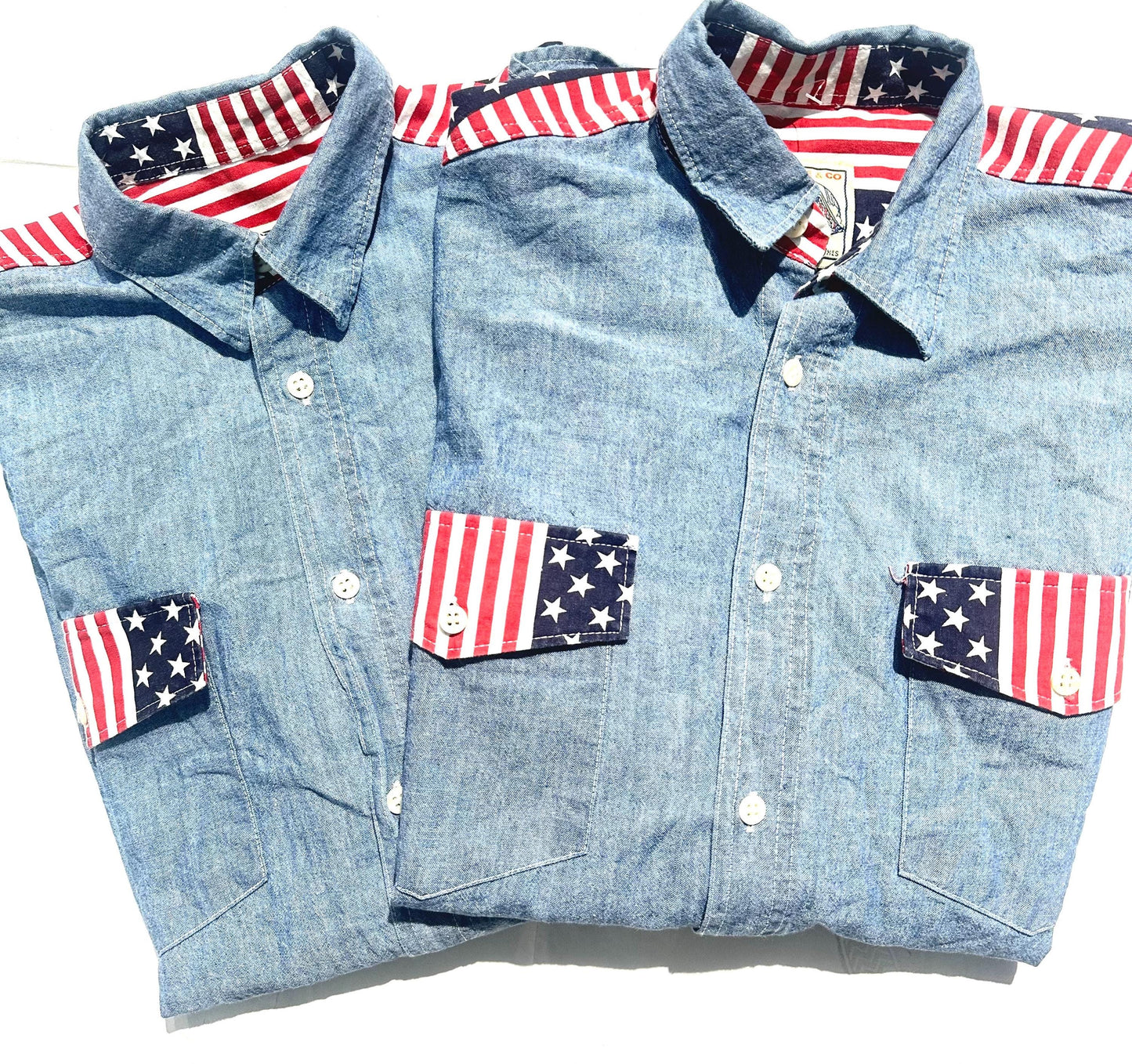 Biscote & Co denim shirt w US flag inserts at the collar, shoulders and cuffs, NoS 80s 2 pcs available.