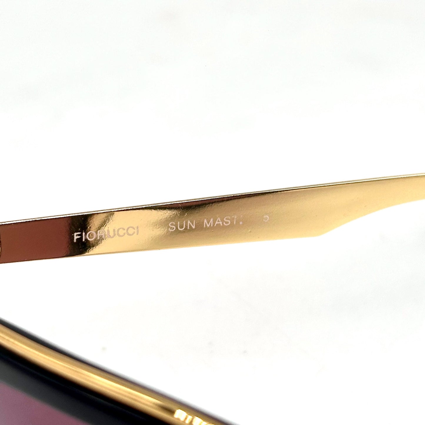 Fiorucci sun master 5 black sunglasses with gold band detail with engraved logo Made in Italy 1980s NOS