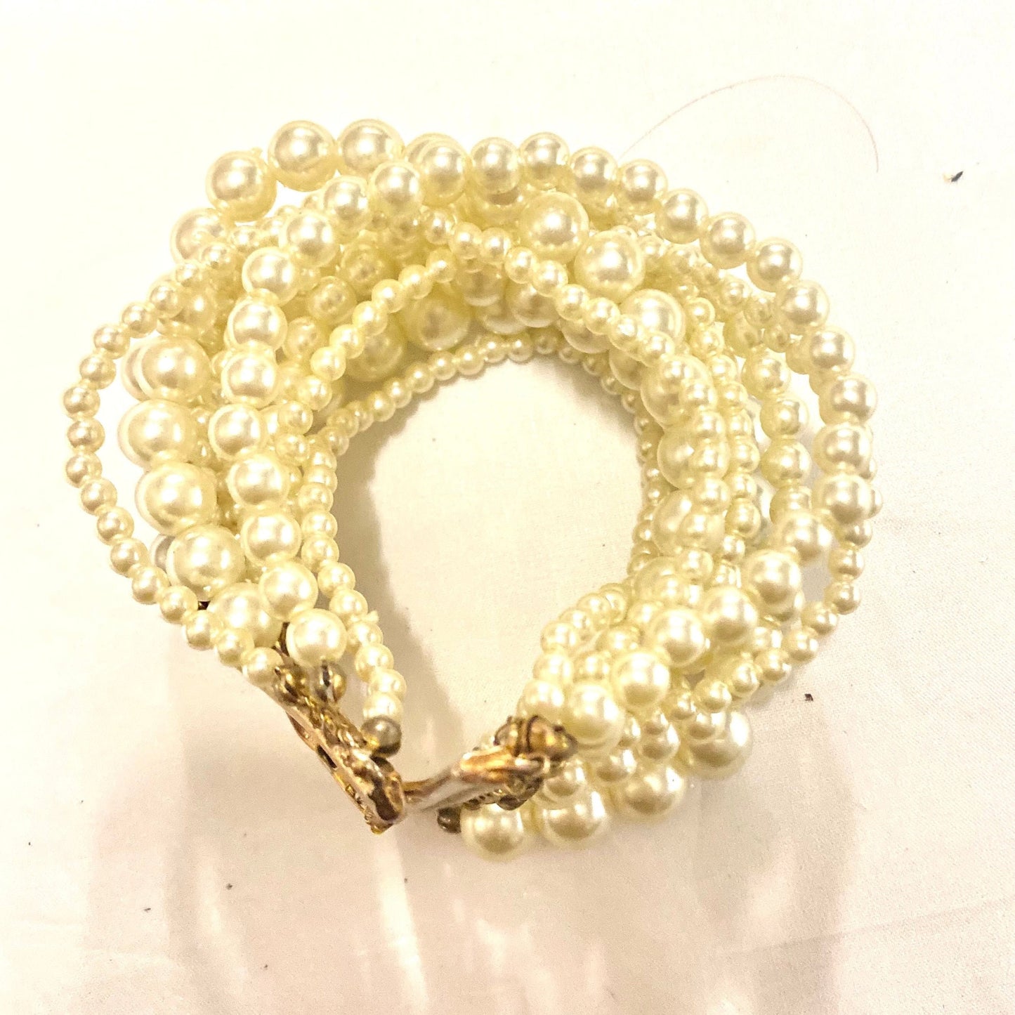 Bracelet w Faux Pearls, multiple lines of different sizes with brass mount, NOS 80s