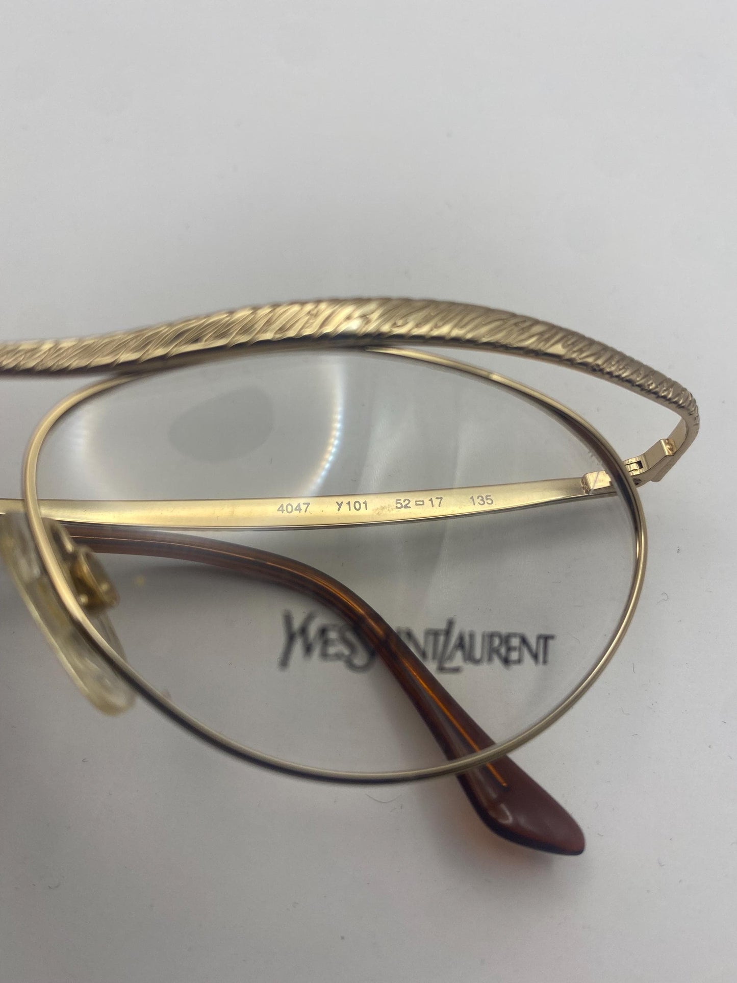 YSL Saint Laurent 4047 modernist golden cateye frames with carved abstract texture, NOS 80s