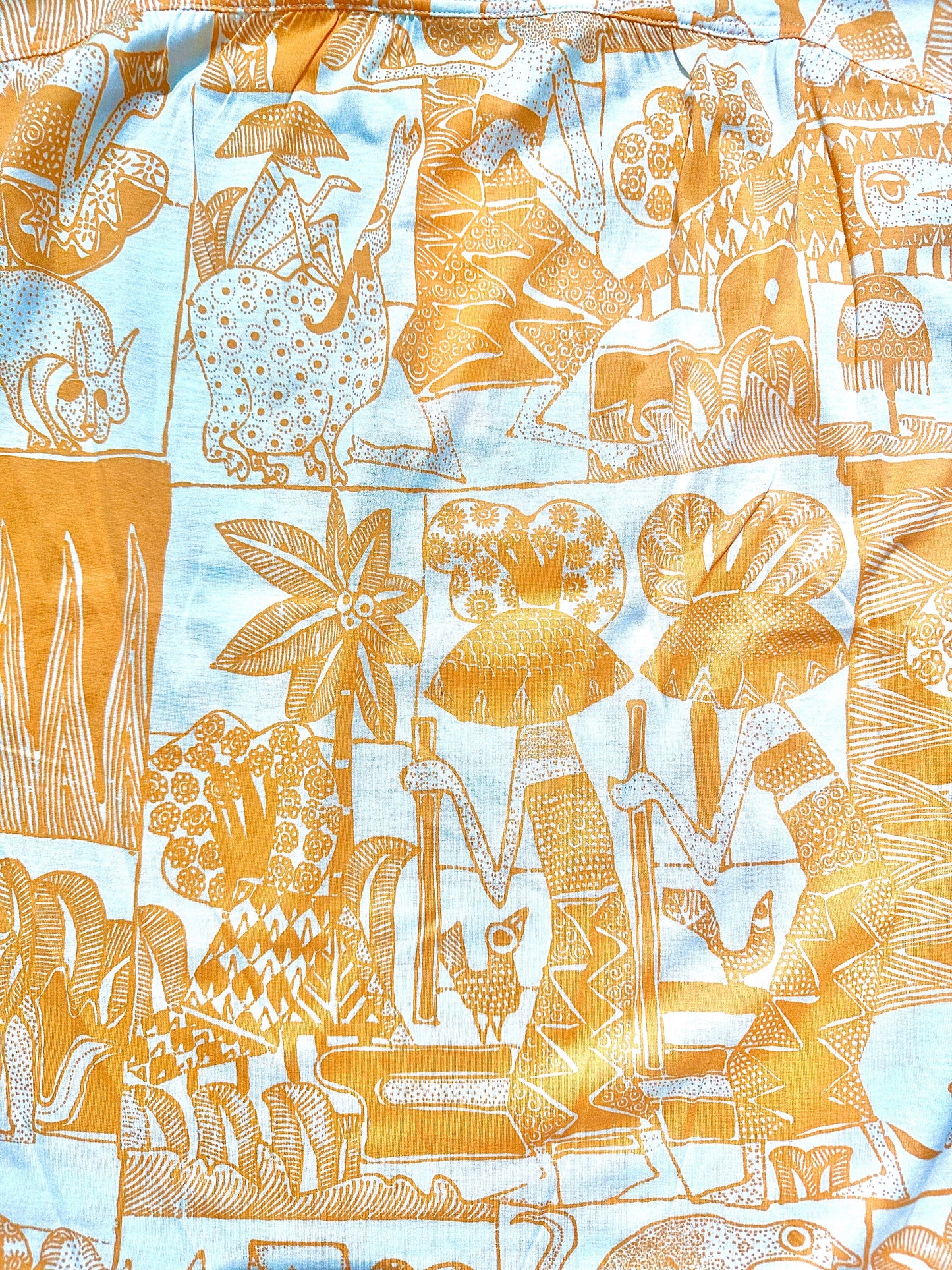 Silvy Couture ladies cotton polo shirts with a beautiful illustration of tribes and domestic animals. NoS 80s mint