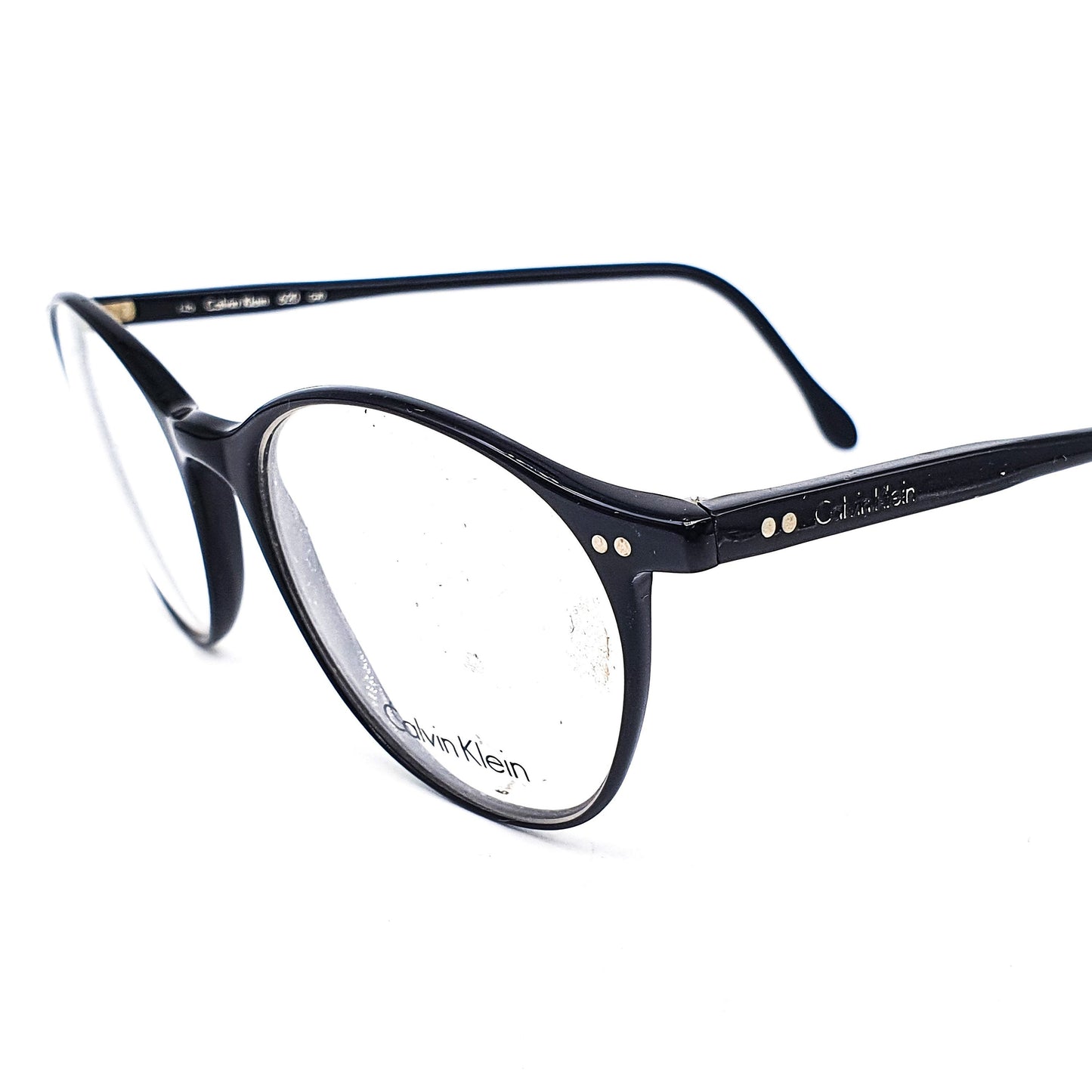 Calvin Klein CK620 round black glossy cellulose acetate eyeglasses frames with classic rivets details NOS 90s Italy