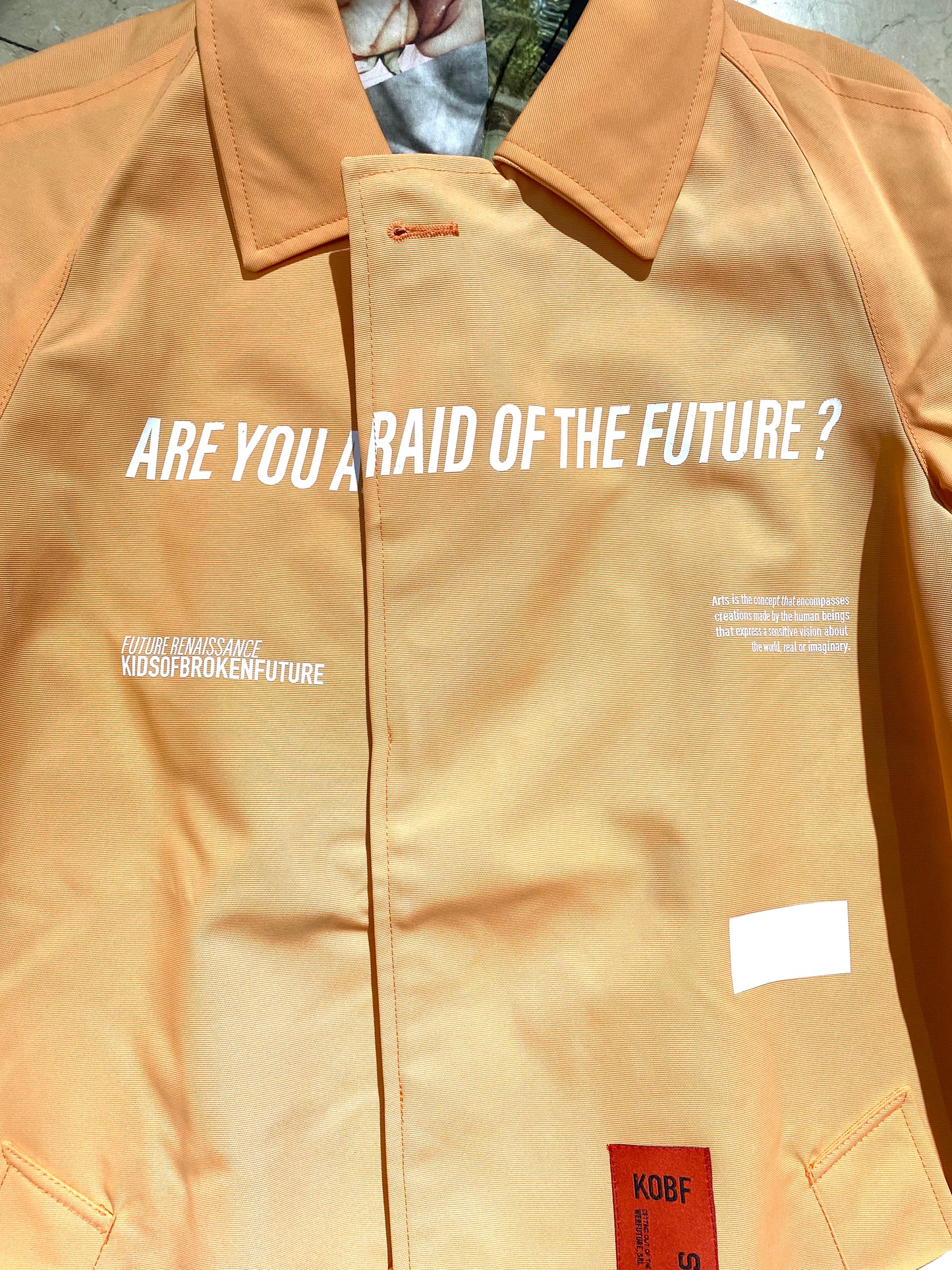 Kids of Broken Future “David” orange Seaqual trenchcoat w cotton neoclassical print lining, S