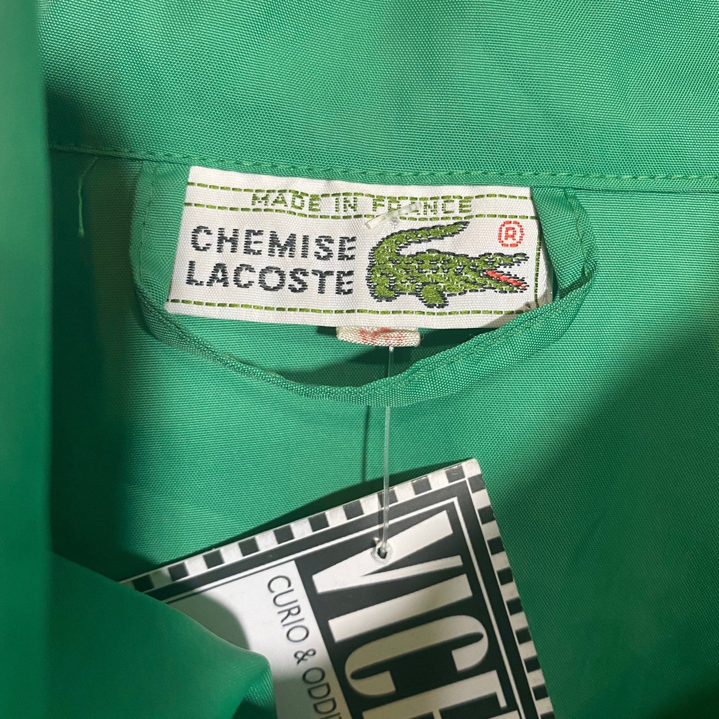 Lacoste 90s primary green windbreaker jacket with bat sleeves, size 44