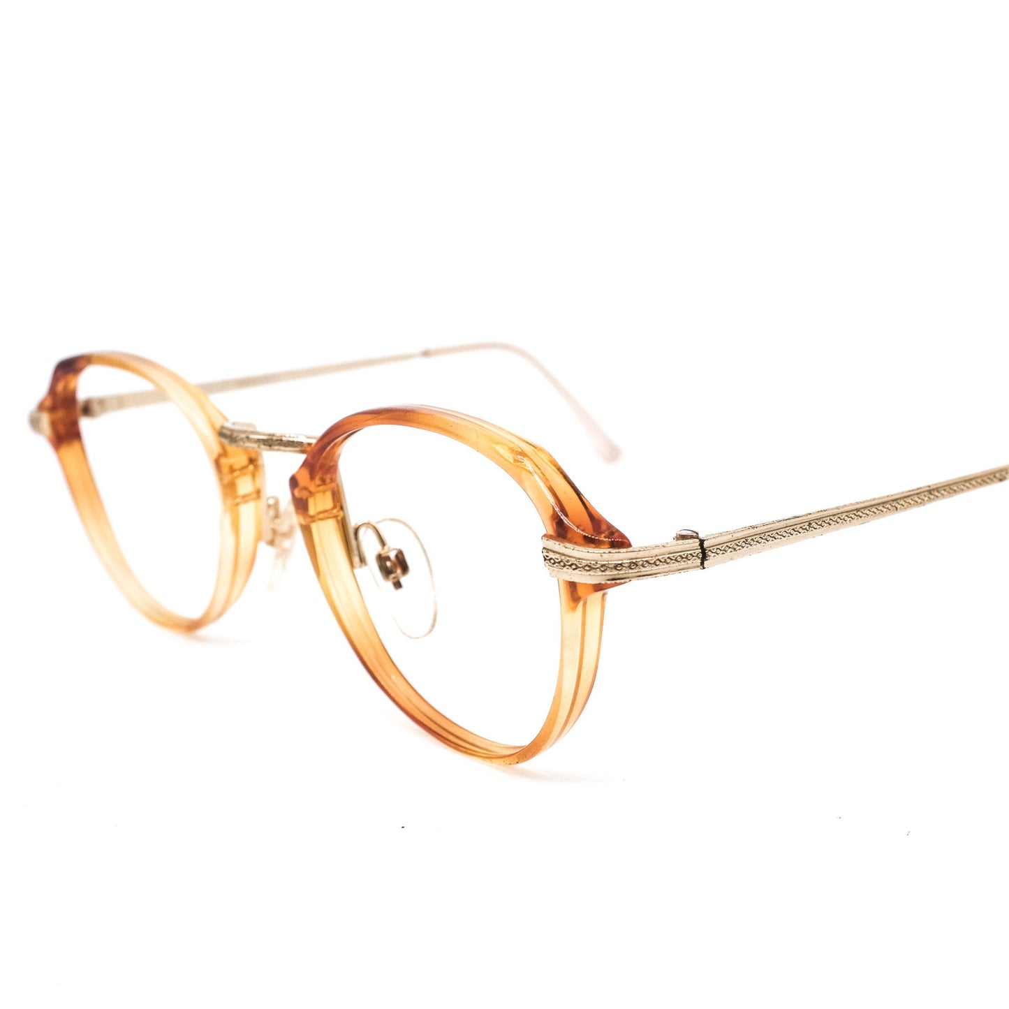 Safilo 1950s oval round cello semi amber eyeglasses frames with carved golden temples and nose bridge. Mint condition Made in Italy