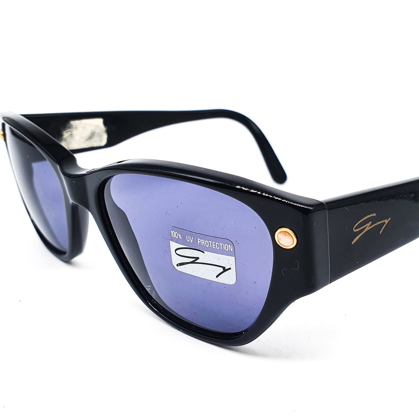 Genny 169s black cellulose acetate cat eye sunglasses With dark blue lenses and shinny golden pins, Italy 70s NOS