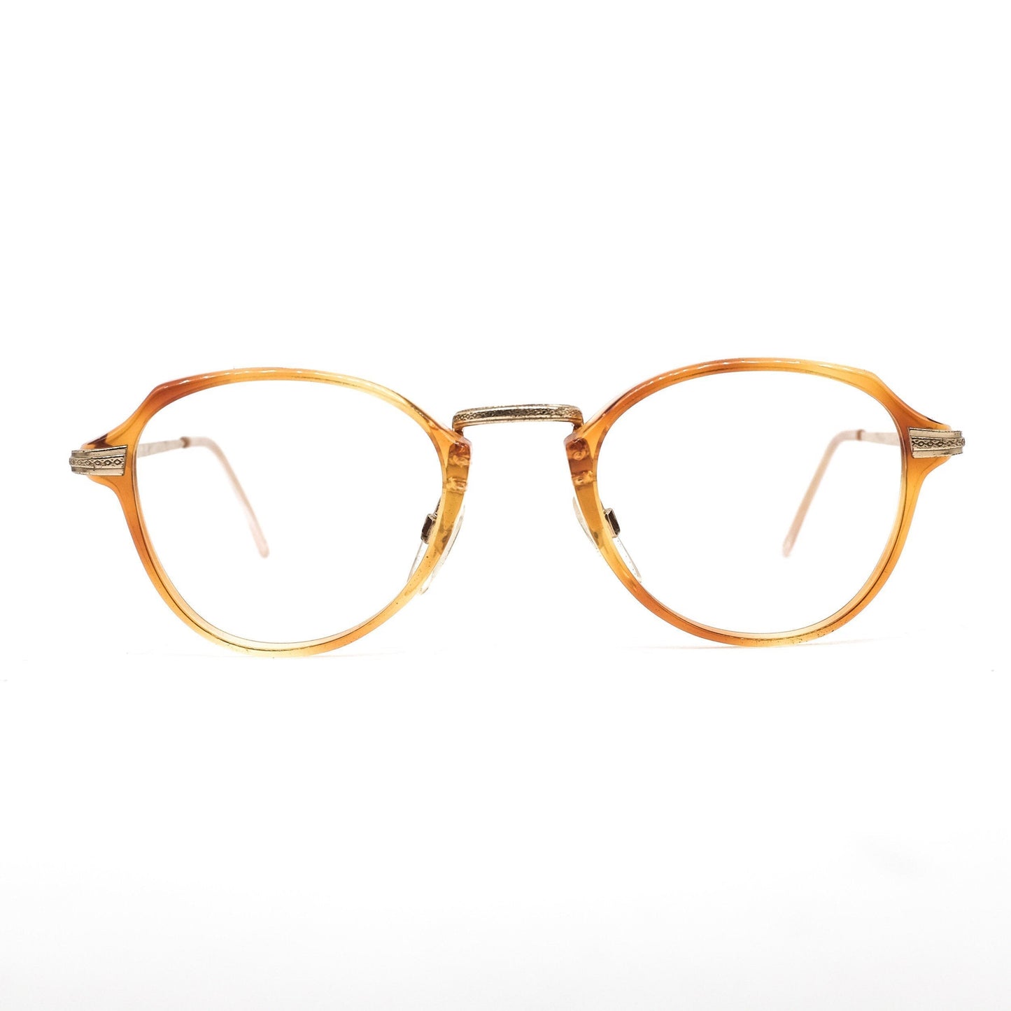 Safilo 1950s oval round cello semi amber eyeglasses frames with carved golden temples and nose bridge. Mint condition Made in Italy
