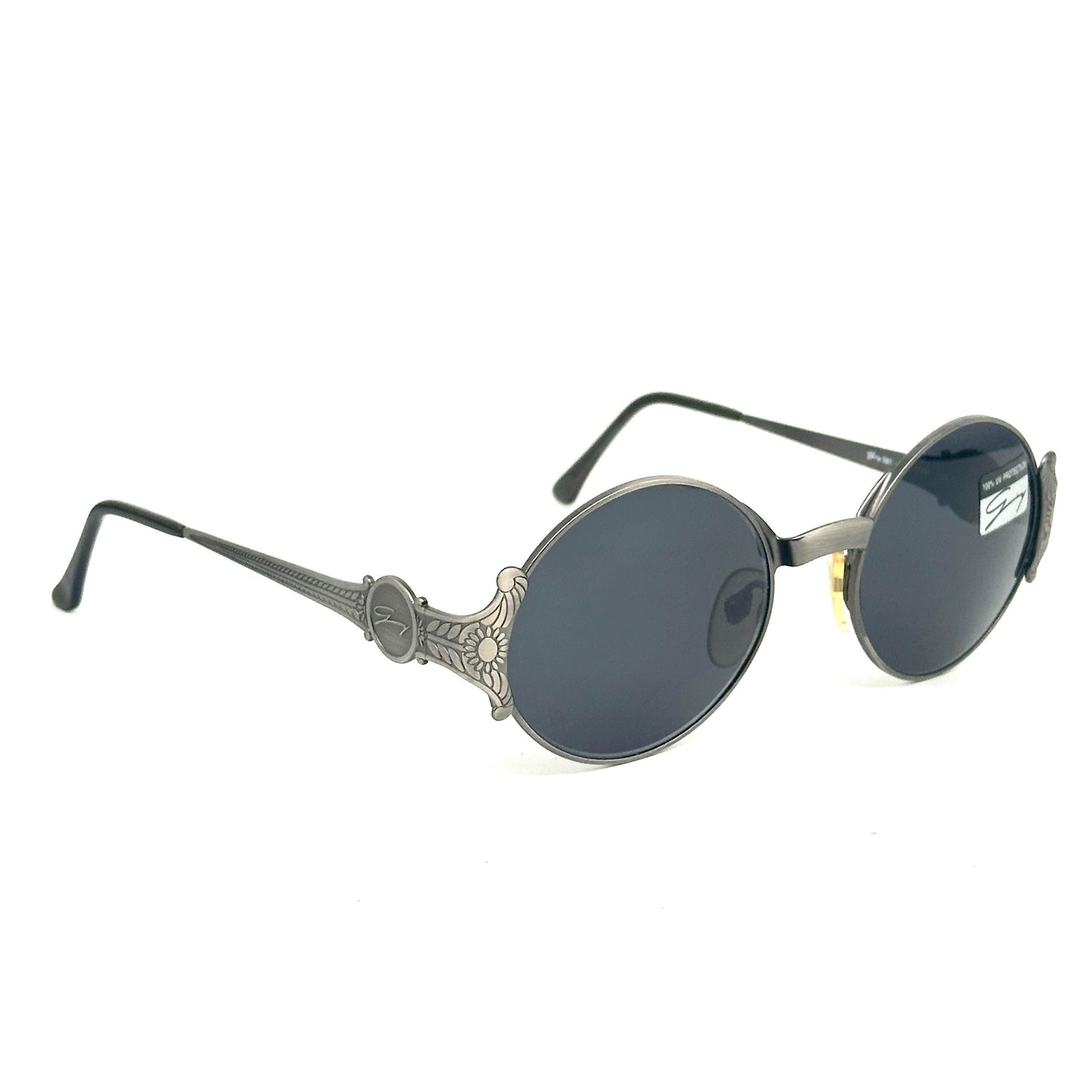 Genny 581-S warm metallic grey oval sunglasses with carved floral temples detail made in Italy 90s NOS