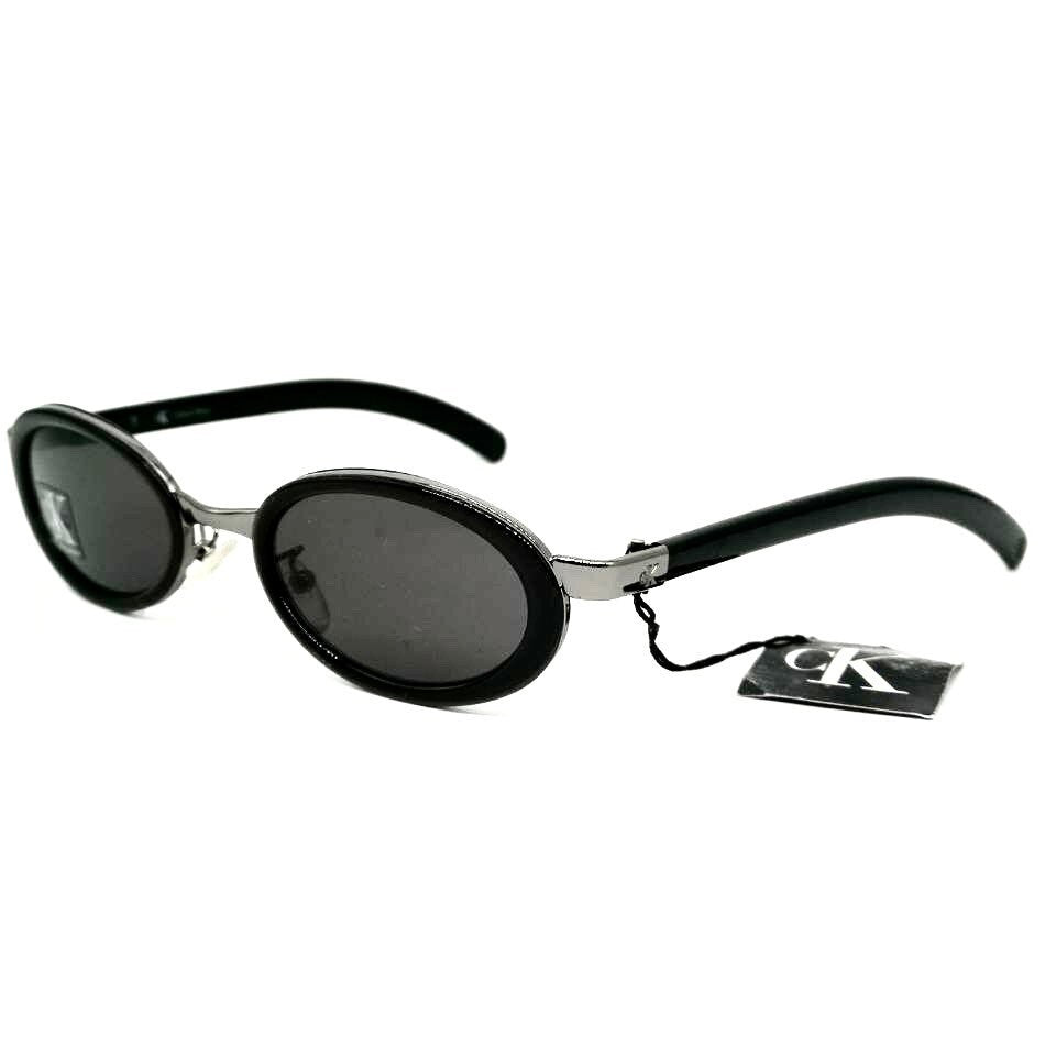 Occhiali da sole ovali neri minimalisti Calvin Klein 1015 made in Italy NOS anni '90