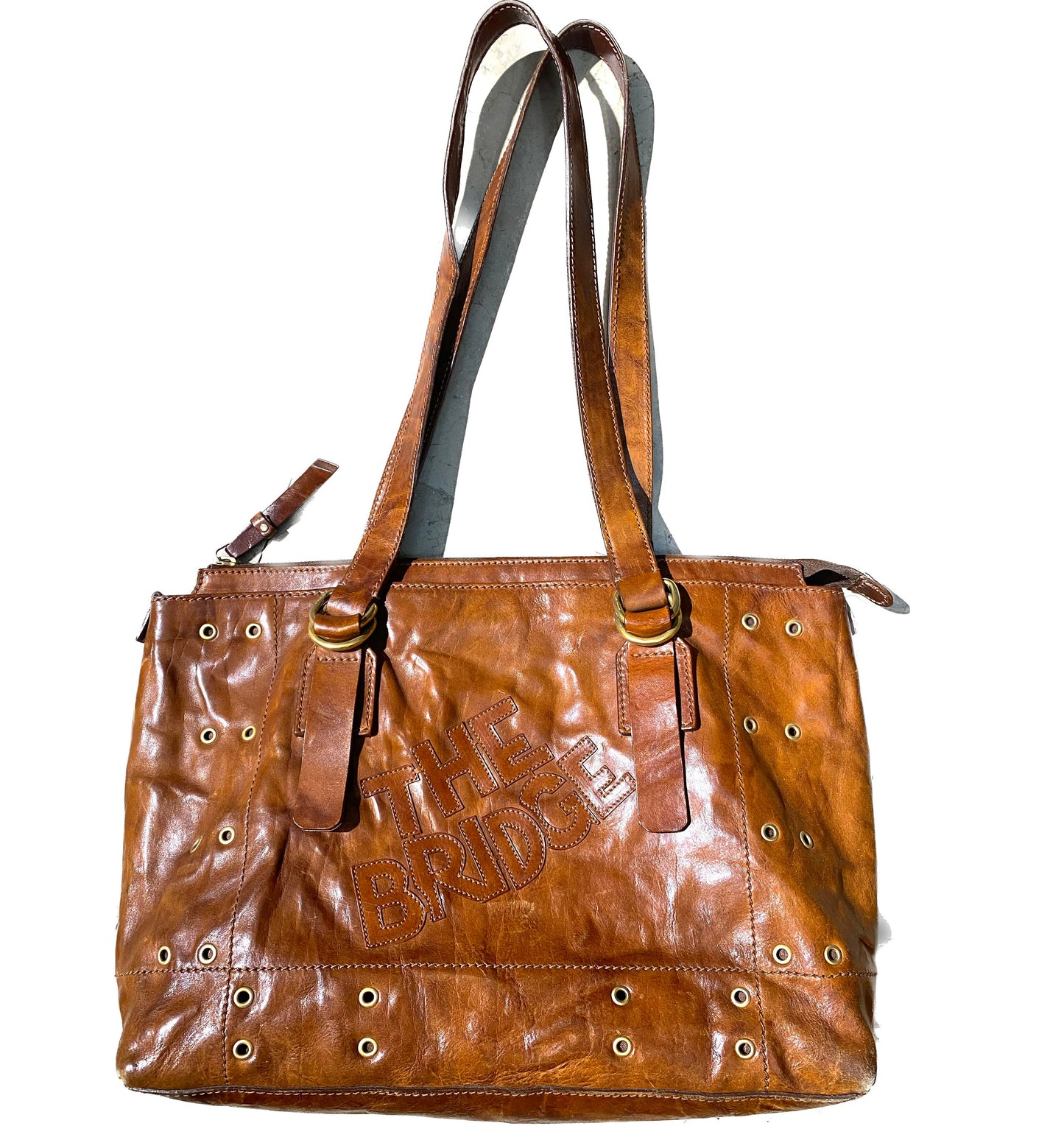 The Bridge tan leather shoulder bag with golden eyelets/studs,  1980s Italy Mint