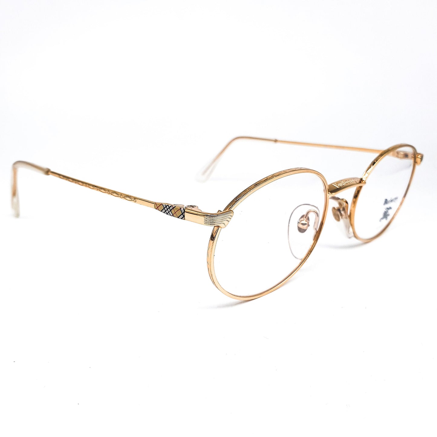 Burberrys B56-01 montature per occhiali ovali metalliche dorate moderniste vintage con classico tartan sulle aste, NOS anni '90 Francia