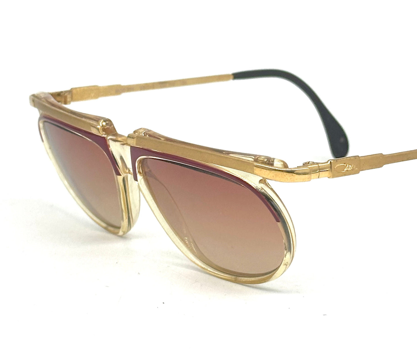 Cazal mod. 335 avant garde clear/red cello sunglasses w golden metal browline and temples, NOS 80s W Germany