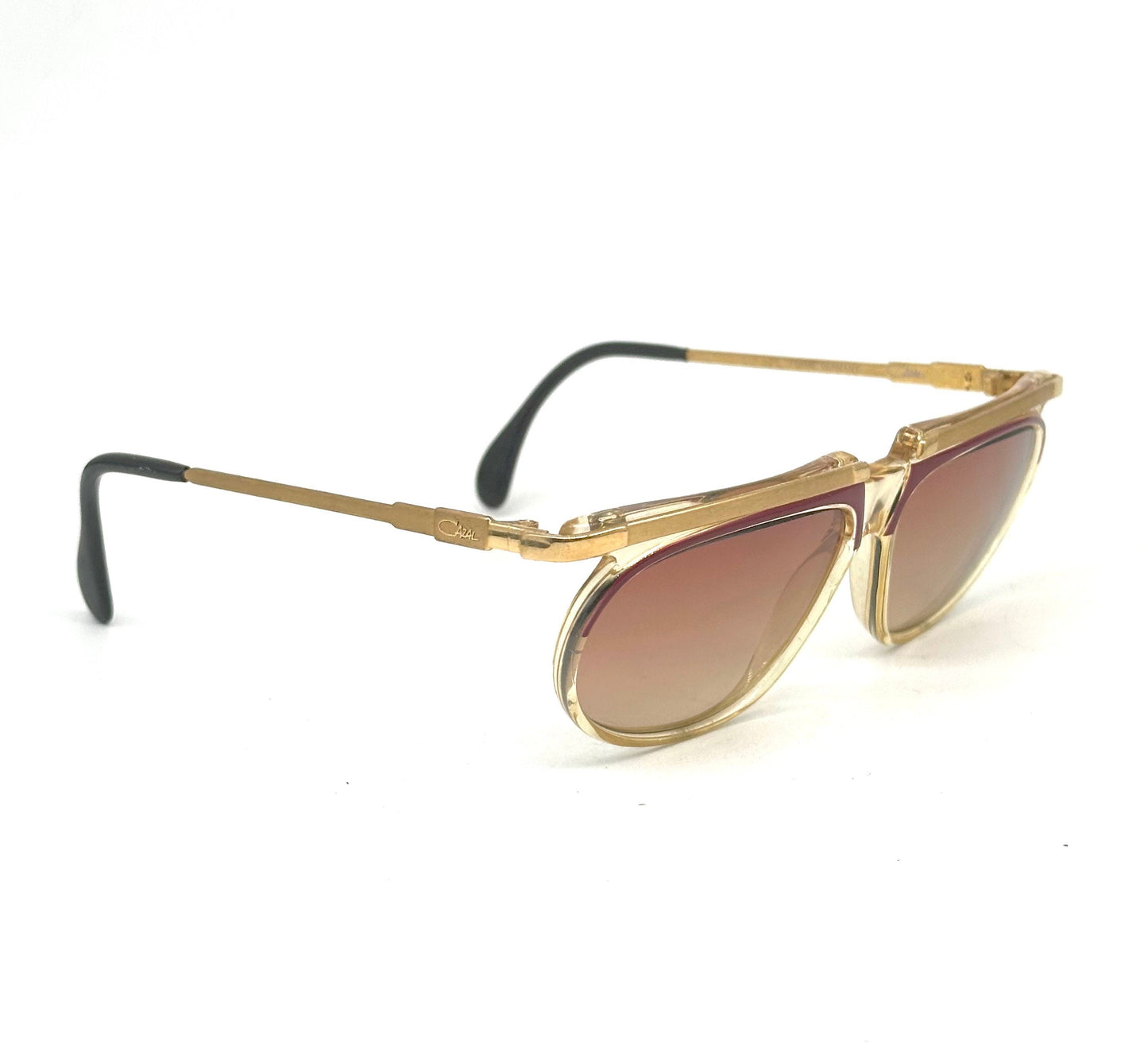 Cazal mod. 335 avant garde clear/red cello sunglasses w golden metal browline and temples, NOS 80s W Germany