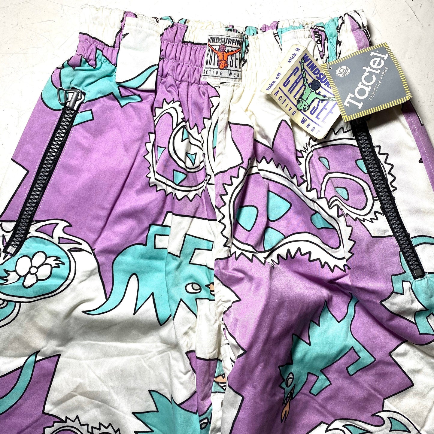 Jet Set purple / turquoise / white dragons / paisley crazy print windsurf padded tactel trousers, NOS 90s