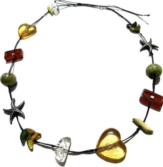 Hand made necklace with a variety of cute pendants, seastar, bakelite lucite and amber elements, unique piece