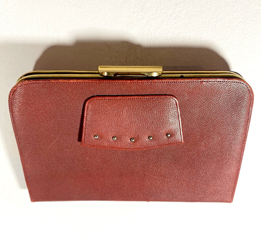 1960s burgundy leather and brass collectible clutch bag in mint condition