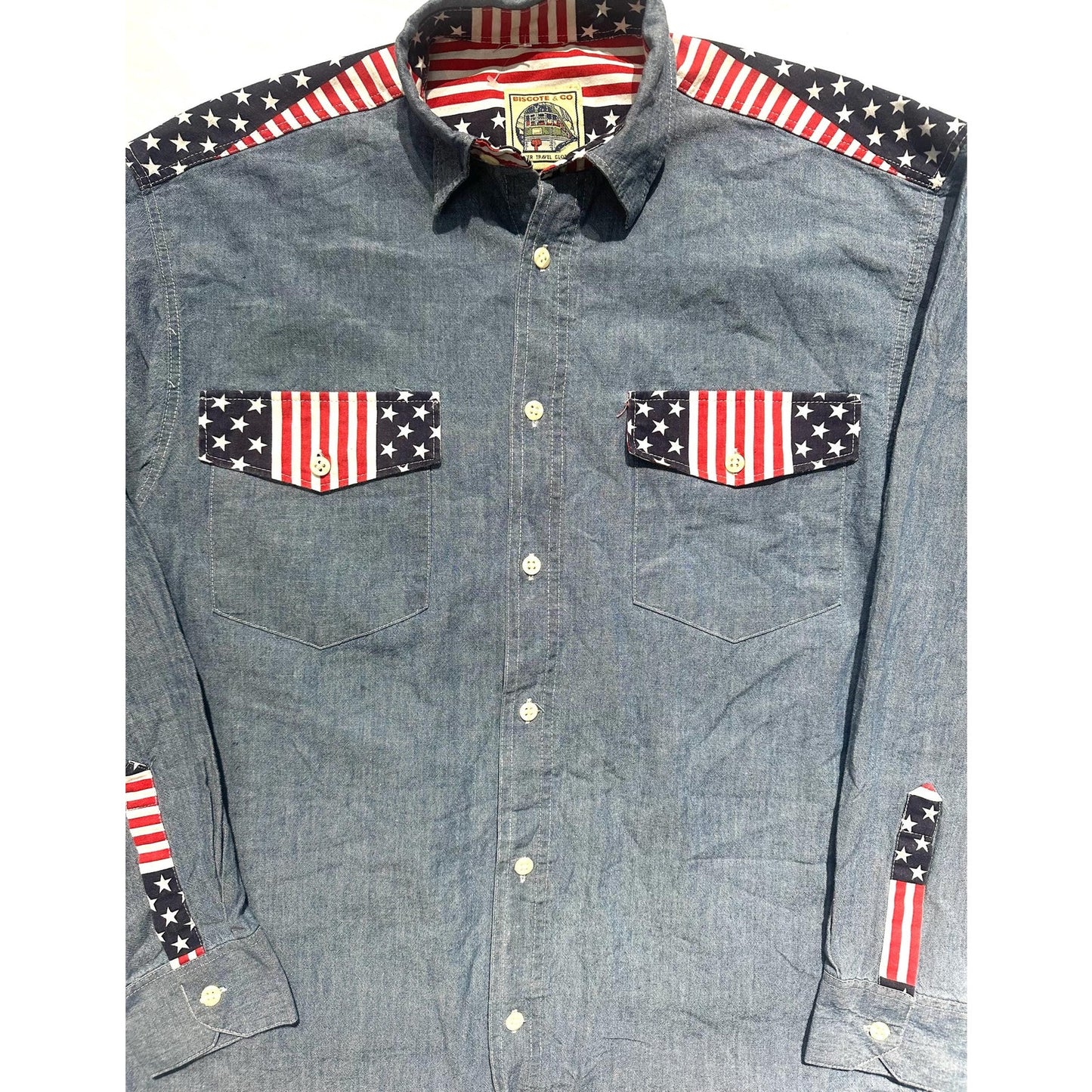 Biscote & Co denim shirt w US flag inserts at the collar, shoulders and cuffs, NoS 80s 2 pcs available.