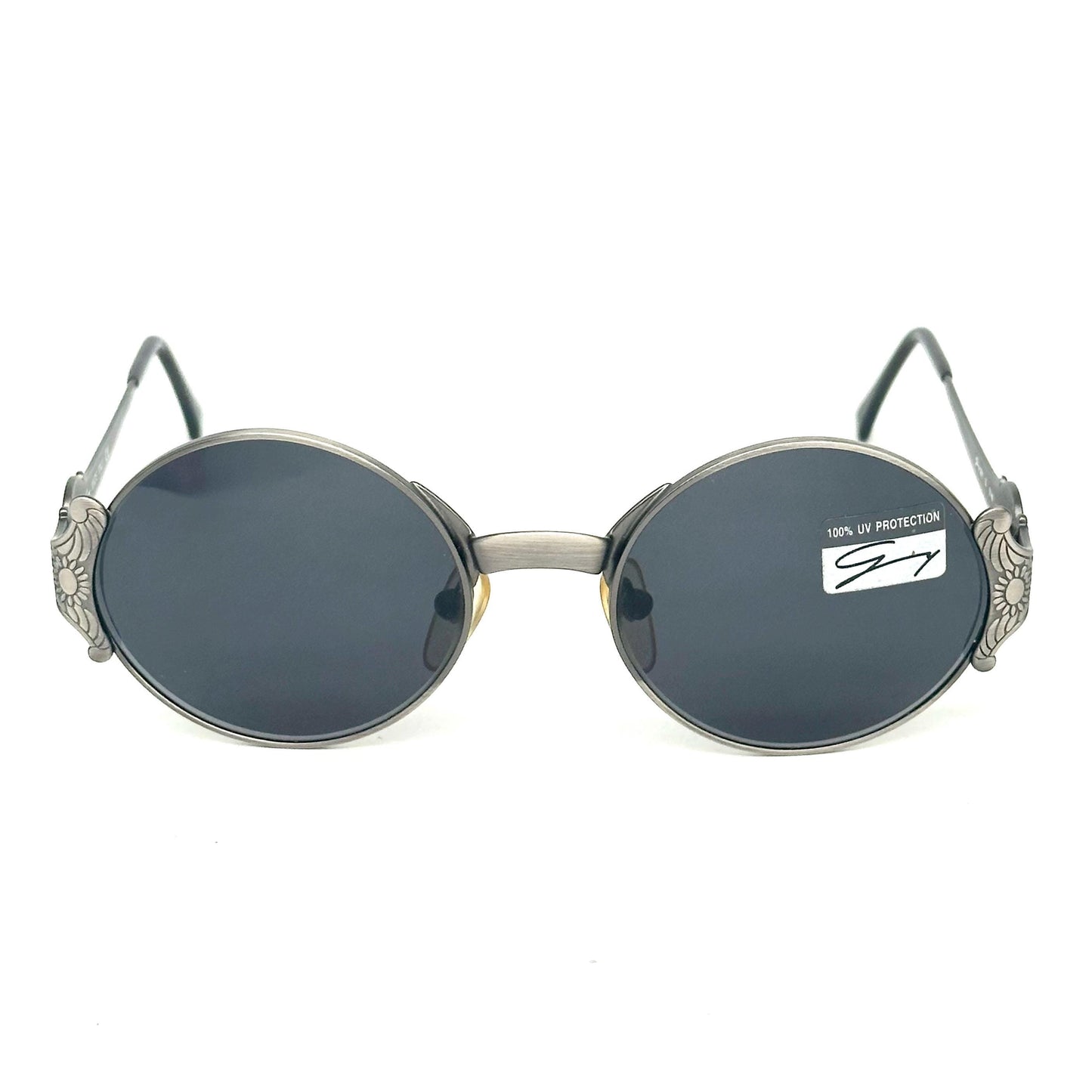 Genny 581-S warm metallic grey oval sunglasses with carved floral temples detail made in Italy 90s NOS