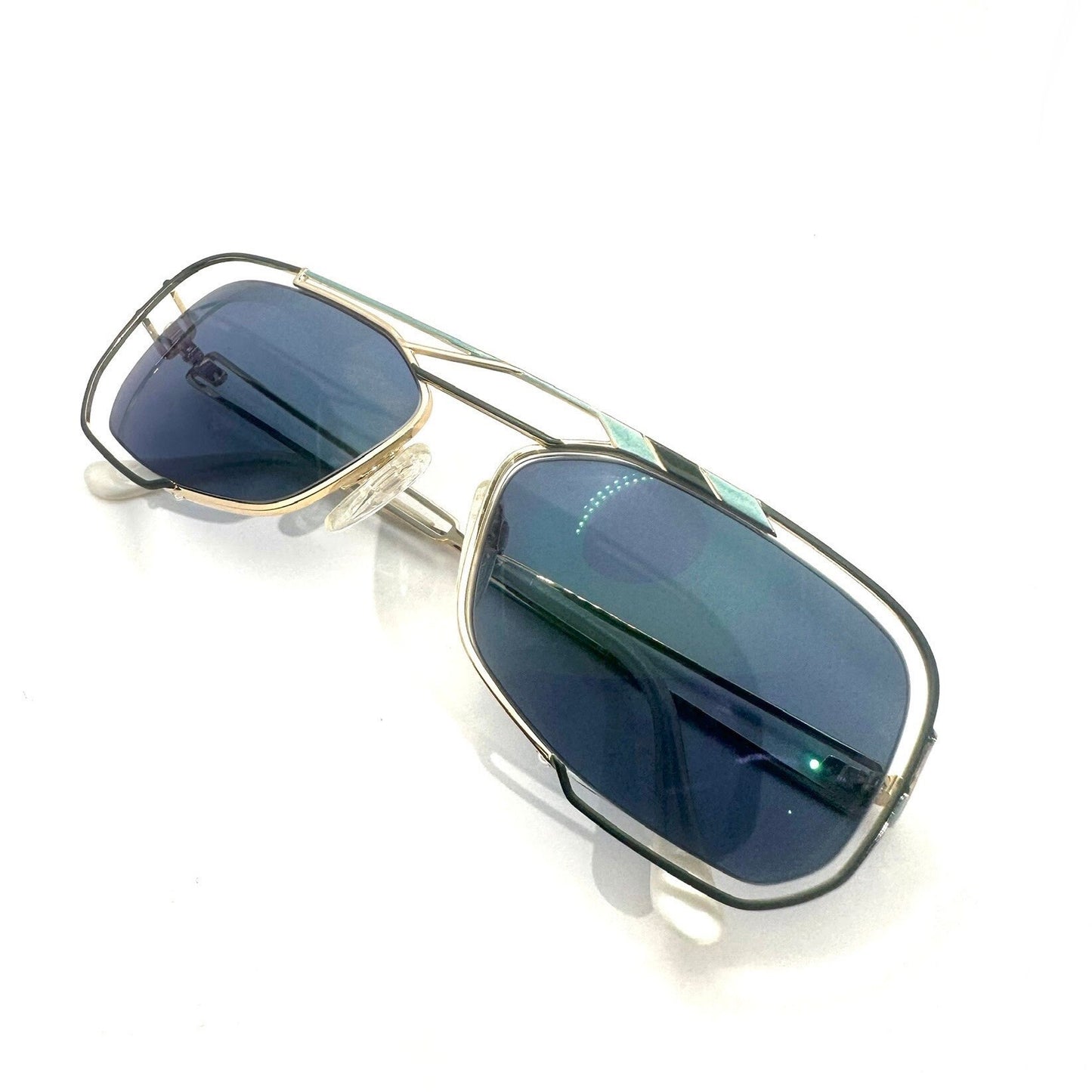 Neostyle jet 222 902 avant Garde sunglasses; gold w green and cyan enamel details & white cream ends, NOS 90s Germany