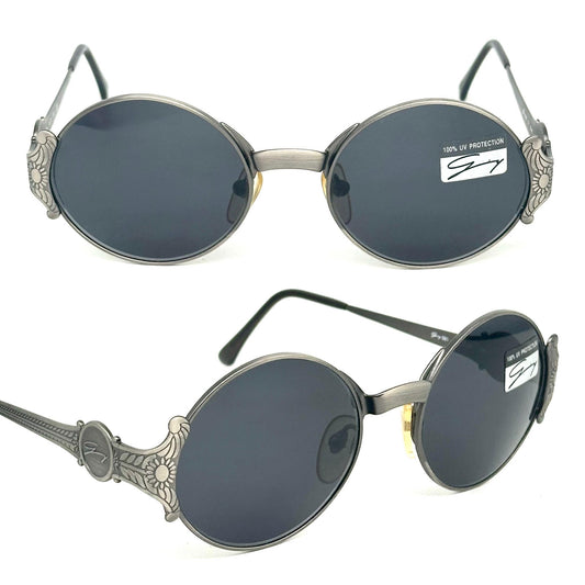Genny 581-S warm metallic grey oval sunglasses with carved floral temples detail made in Italy 90s NOS