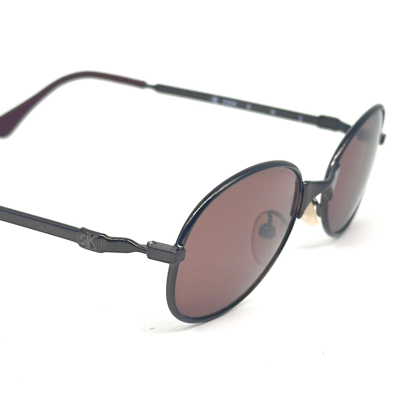 Calvin Klein 2004 gunmetal oval shaped sunglasses made in Italy, 90s NoS