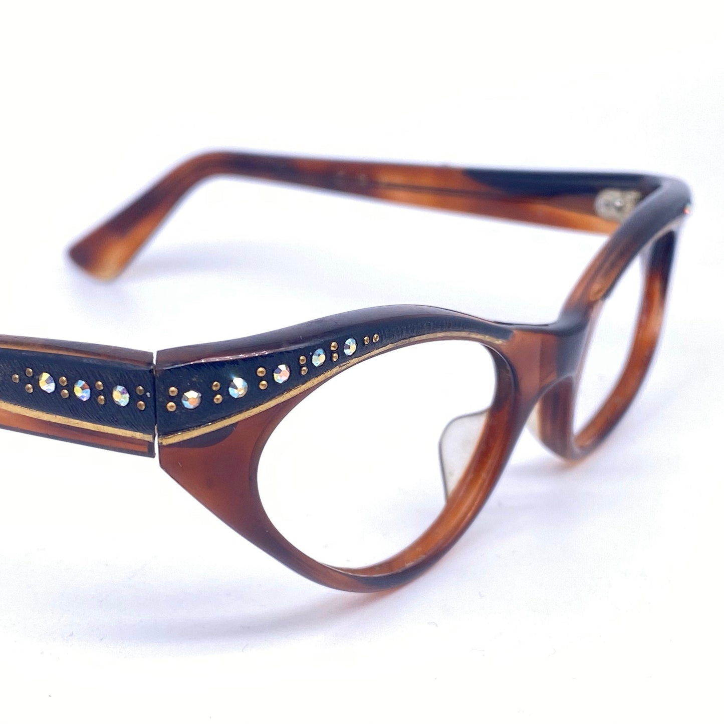Black / tortoiseshell cateye eyeglasses with rhinestones and carved gold details, France 1950s NOS