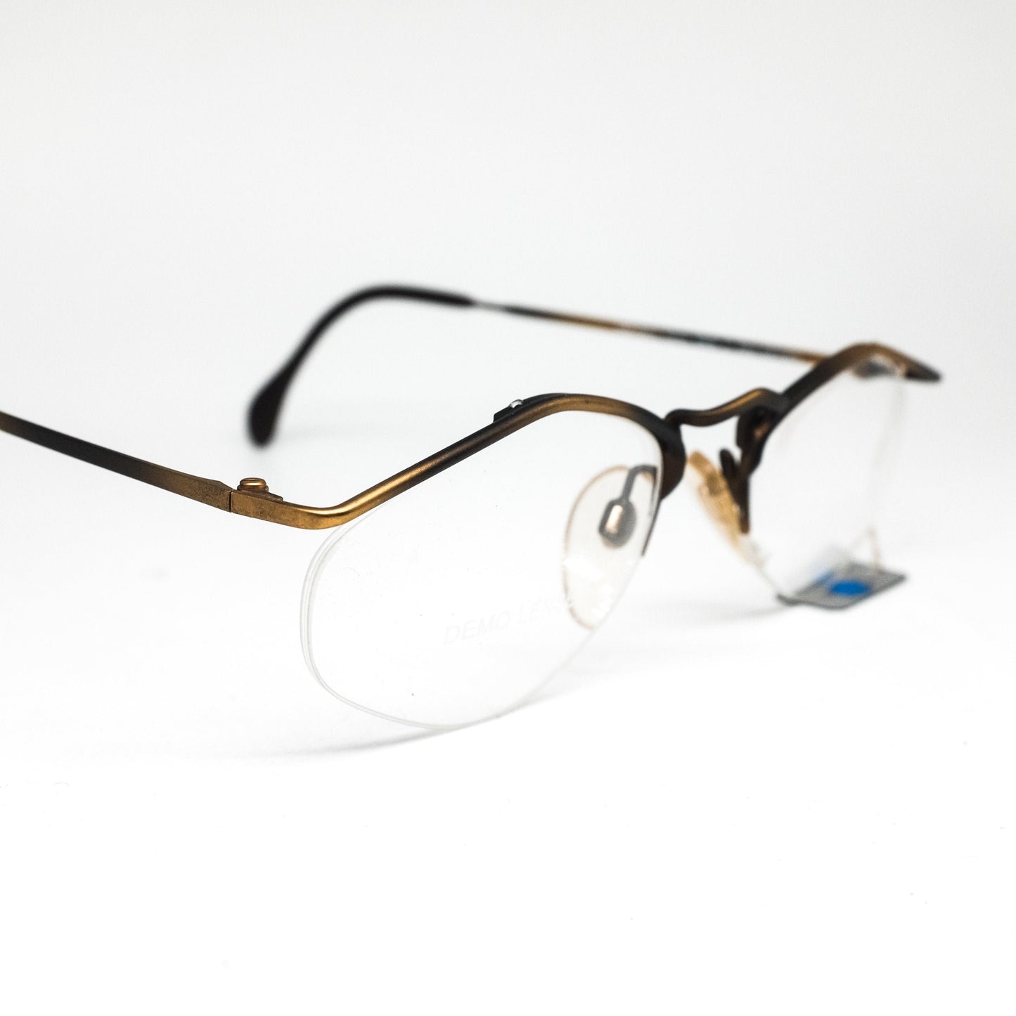 YABI-spirit minimal matt gold metallic eyeglasses frames in rimless design with pointing browline, 1980s NOS Germany.