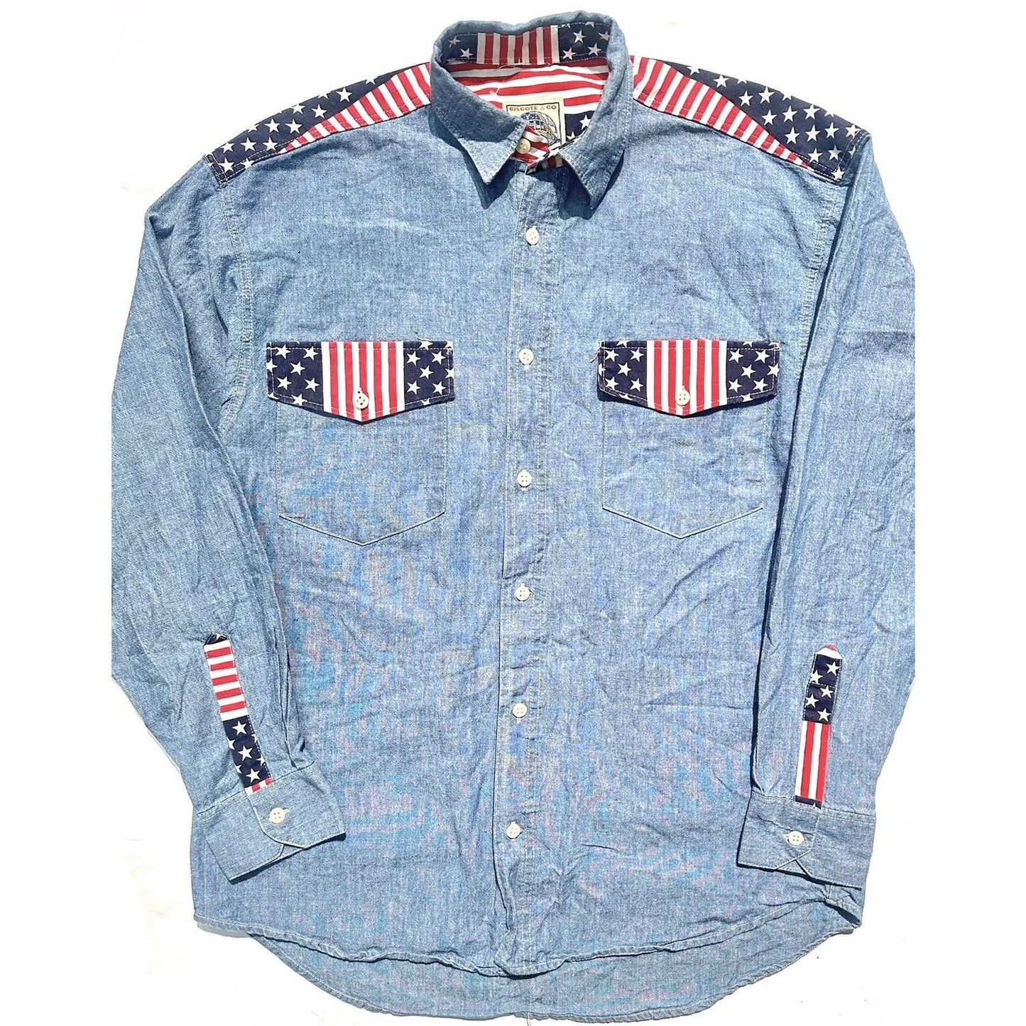 Biscote & Co denim shirt w US flag inserts at the collar, shoulders and cuffs, NoS 80s 2 pcs available.