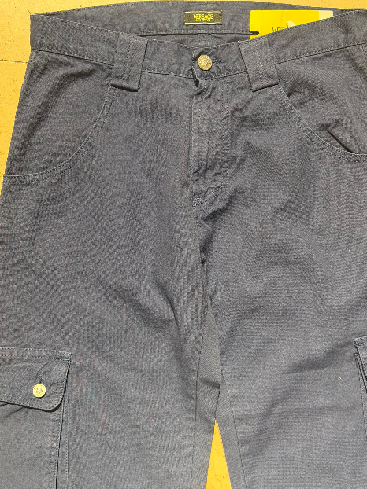 Versace Jeans Couture BNWT blue cotton capri cargo trousers w Medusa buttons, sz 28 & 30 available.