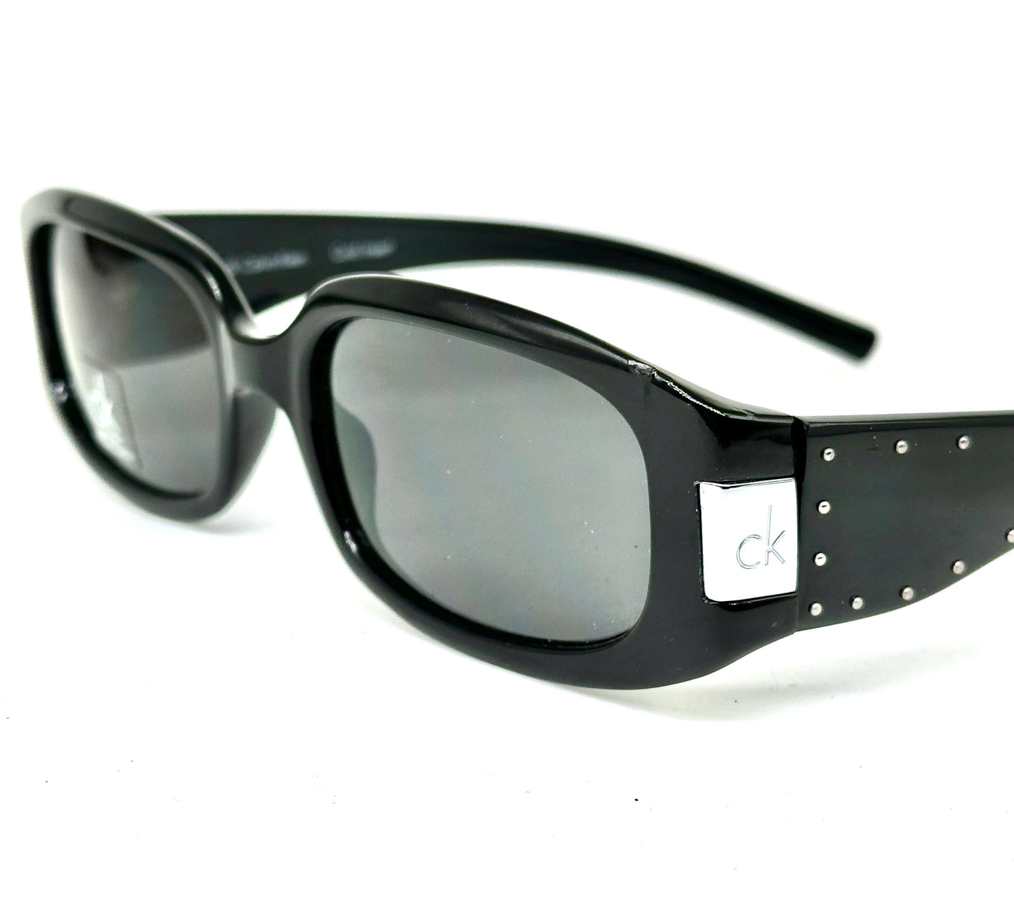 Calvin Klein 3045 sunglasses,  black gloss wrap frames w silver metal studs & branded hinge, NOS