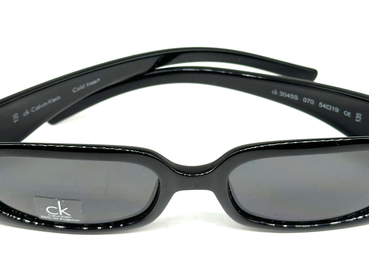 Calvin Klein 3045 sunglasses,  black gloss wrap frames w silver metal studs & branded hinge, NOS