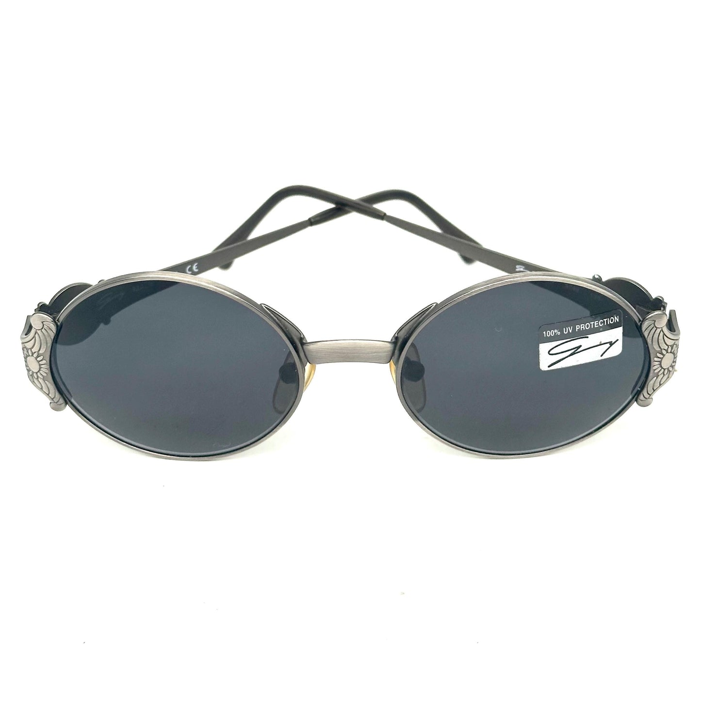 Genny 581-S warm metallic grey oval sunglasses with carved floral temples detail made in Italy 90s NOS