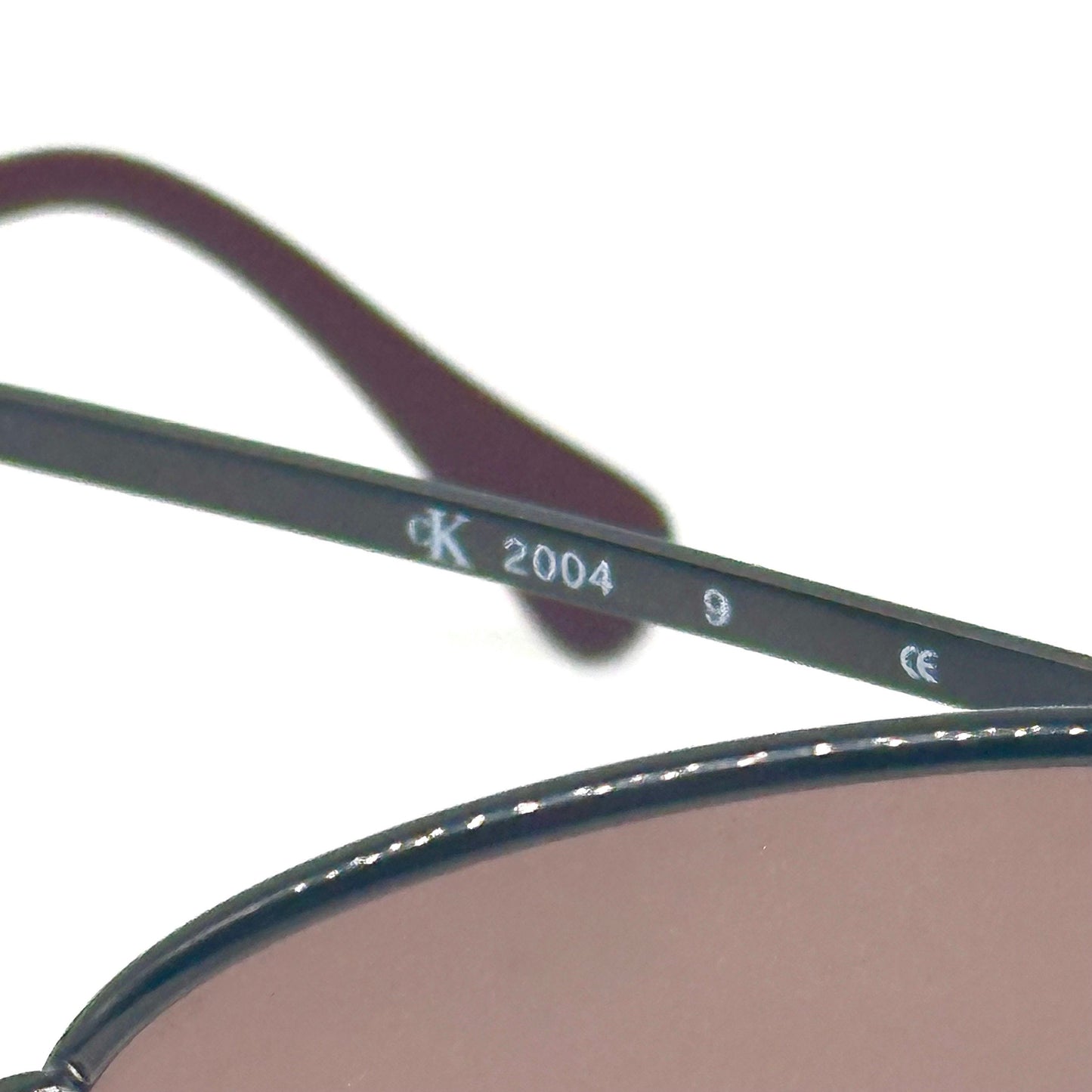 Calvin Klein 2004 gunmetal oval shaped sunglasses made in Italy, 90s NoS