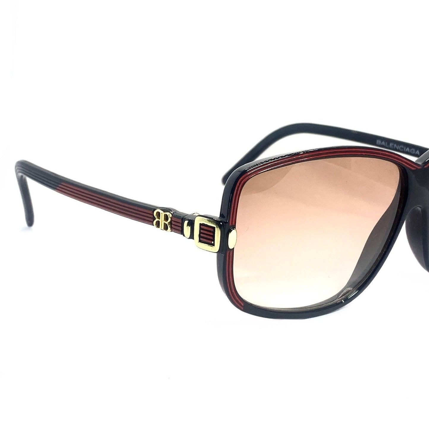 Balenciaga 2026 NR oversized black sunglasses with red carved stripes and golden logo, 80s Made in France