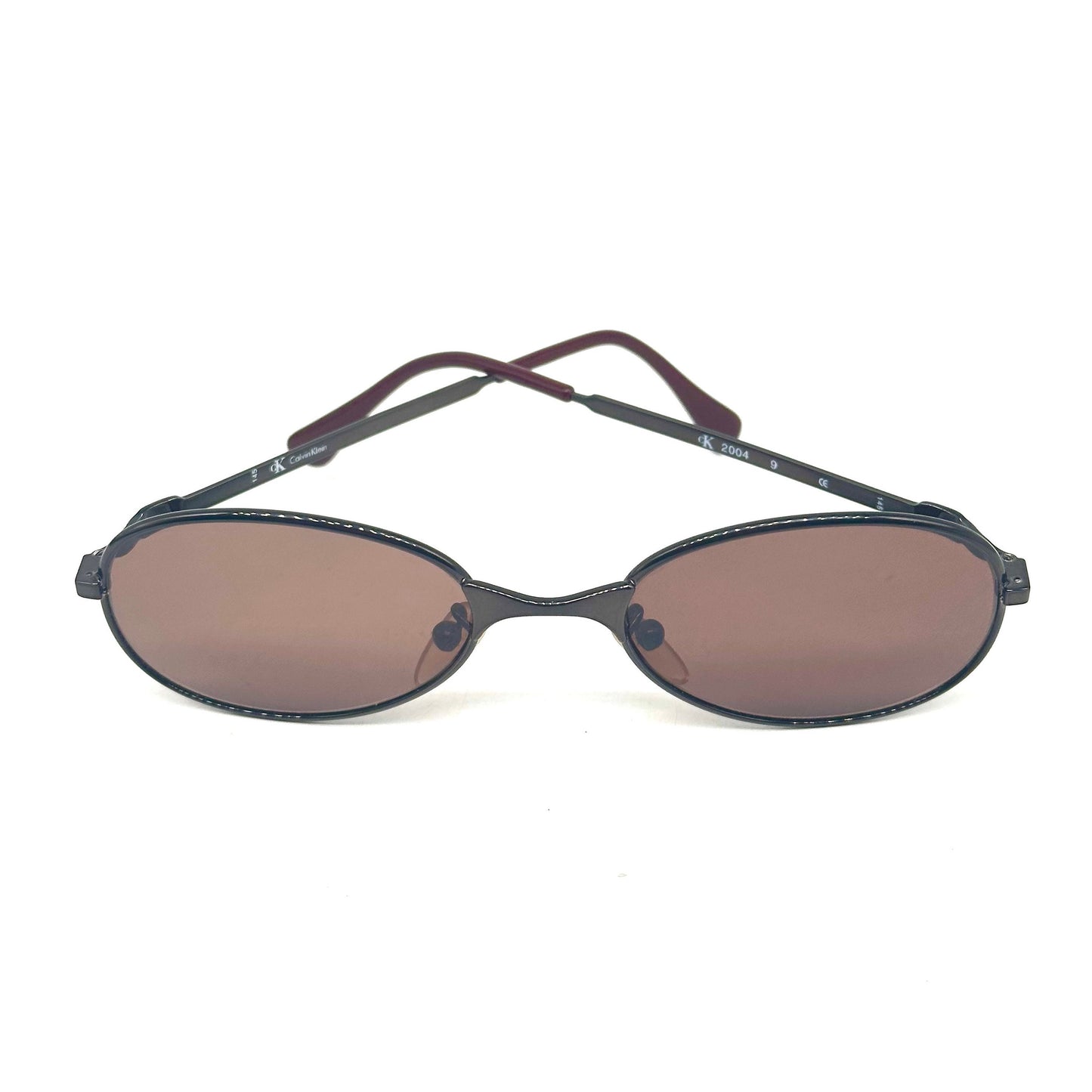 Calvin Klein 2004 gunmetal oval shaped sunglasses made in Italy, 90s NoS