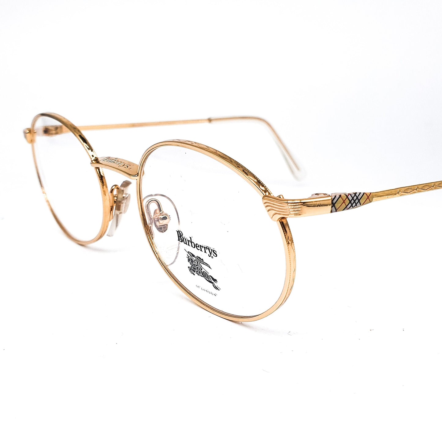 Burberrys B56-01 montature per occhiali ovali metalliche dorate moderniste vintage con classico tartan sulle aste, NOS anni '90 Francia