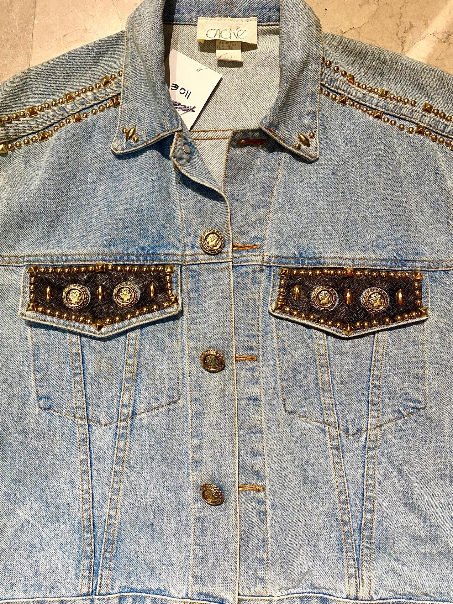 Caché USA light blue denim vest customised w leather, golden jewel buttons & studs, sz L