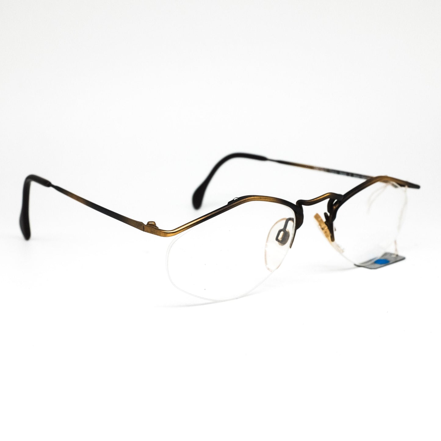 YABI-spirit minimal matt gold metallic eyeglasses frames in rimless design with pointing browline, 1980s NOS Germany.