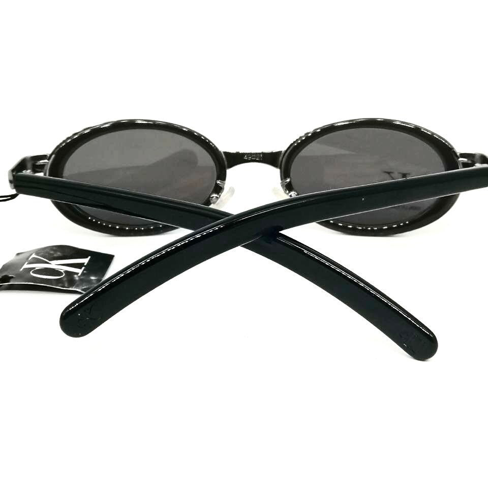 Occhiali da sole ovali neri minimalisti Calvin Klein 1015 made in Italy NOS anni '90
