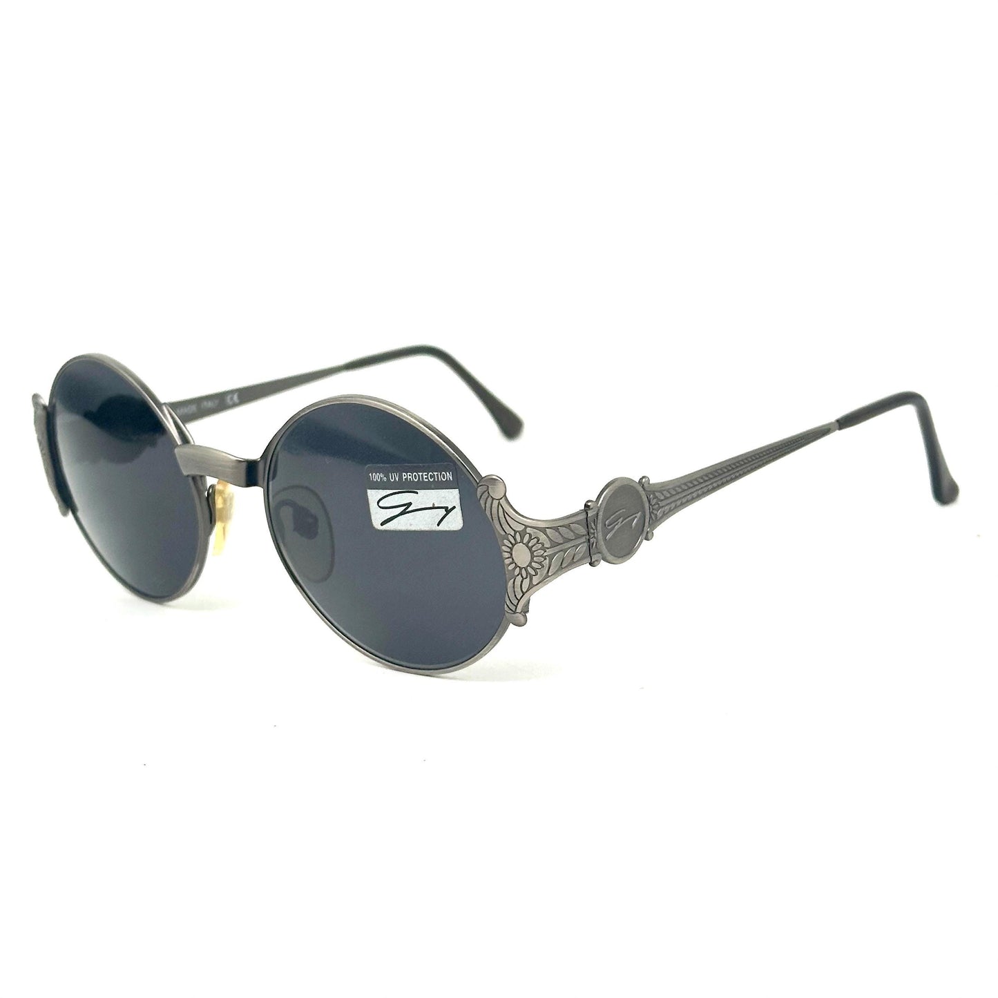 Genny 581-S warm metallic grey oval sunglasses with carved floral temples detail made in Italy 90s NOS