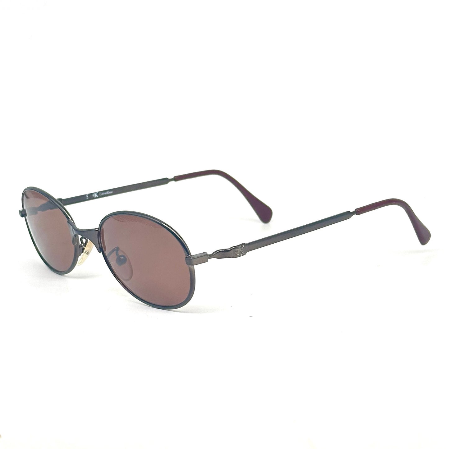 Calvin Klein 2004 gunmetal oval shaped sunglasses made in Italy, 90s NoS