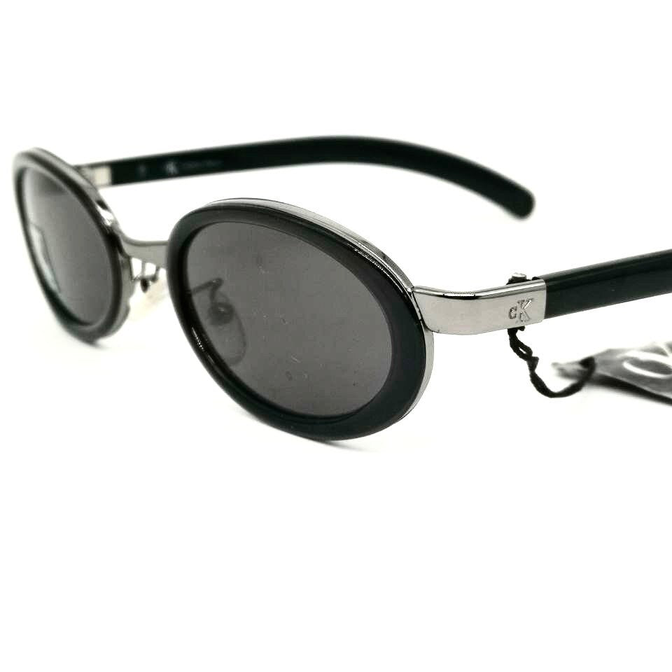 Occhiali da sole ovali neri minimalisti Calvin Klein 1015 made in Italy NOS anni '90