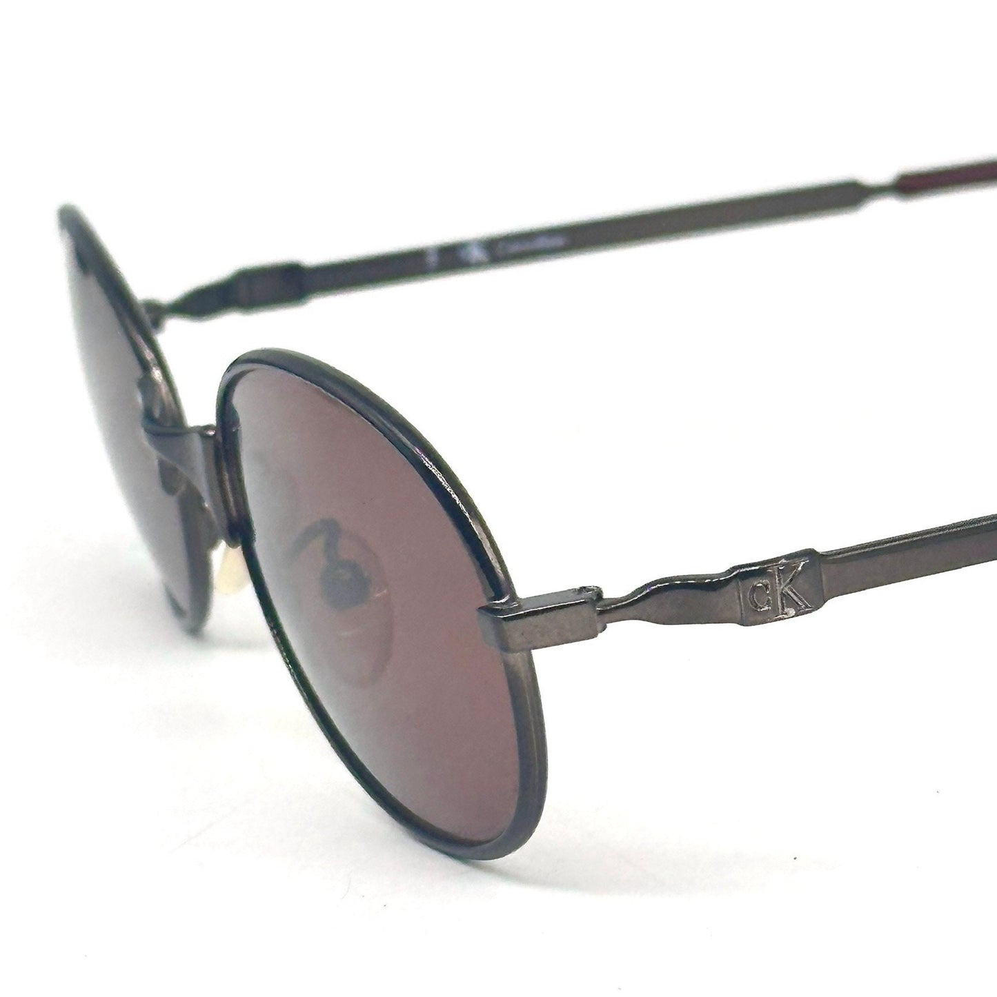Calvin Klein 2004 gunmetal oval shaped sunglasses made in Italy, 90s NoS