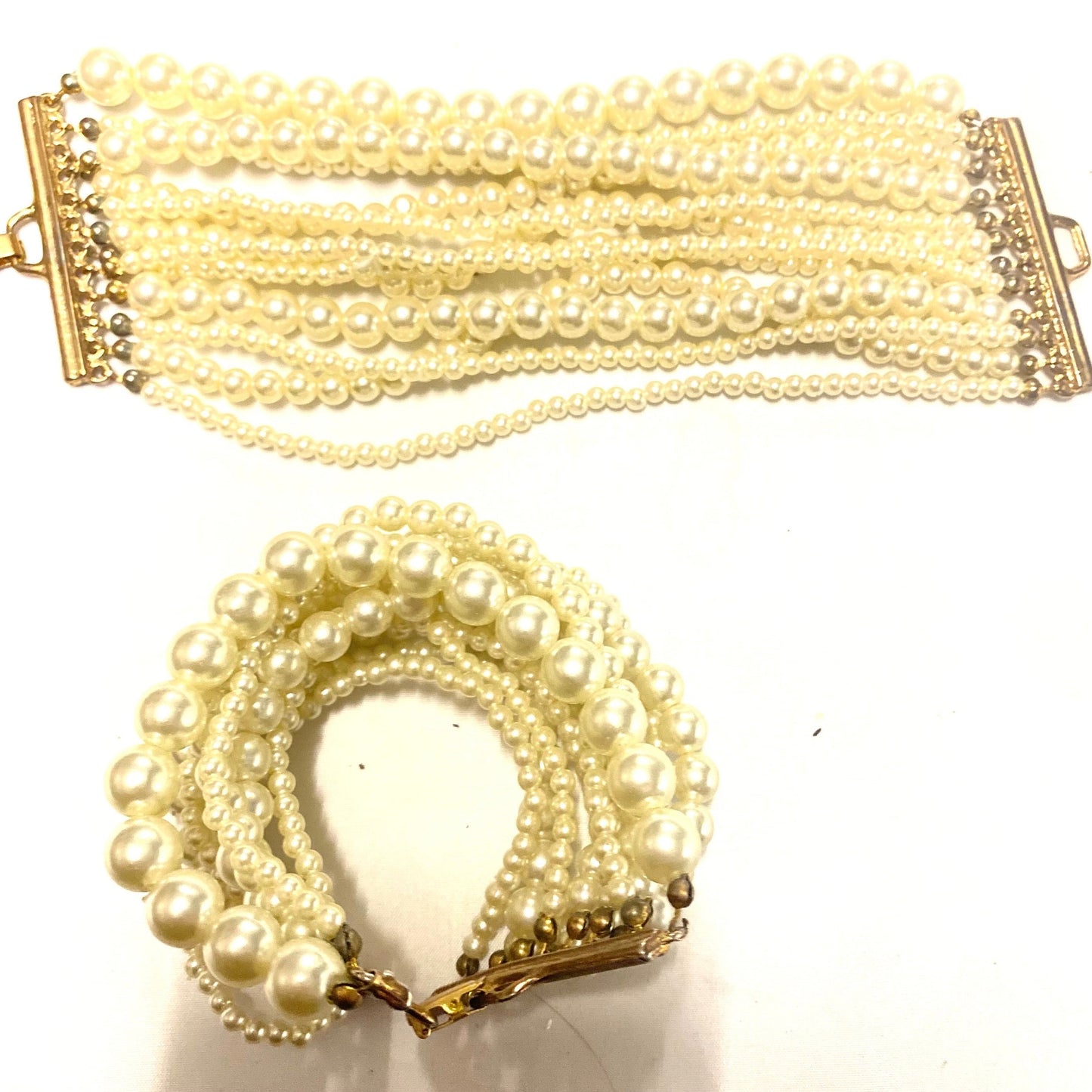 Bracelet w Faux Pearls, multiple lines of different sizes  with brass mount, NOS 80s