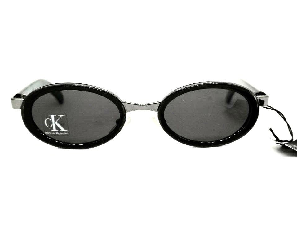Occhiali da sole ovali neri minimalisti Calvin Klein 1015 made in Italy NOS anni '90
