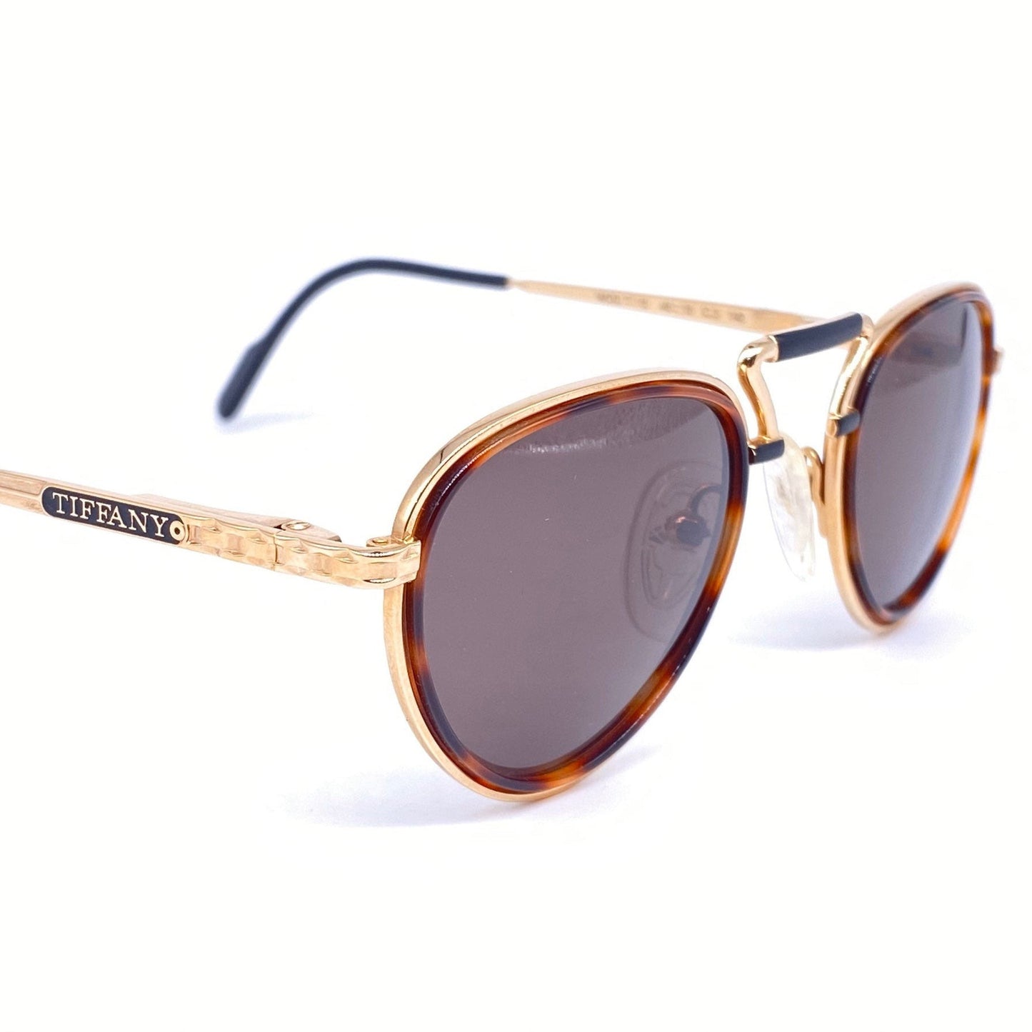 Tiffanys 23K gold plated round sunglasses with a superb design, rare and collectible piece in NOS condition.