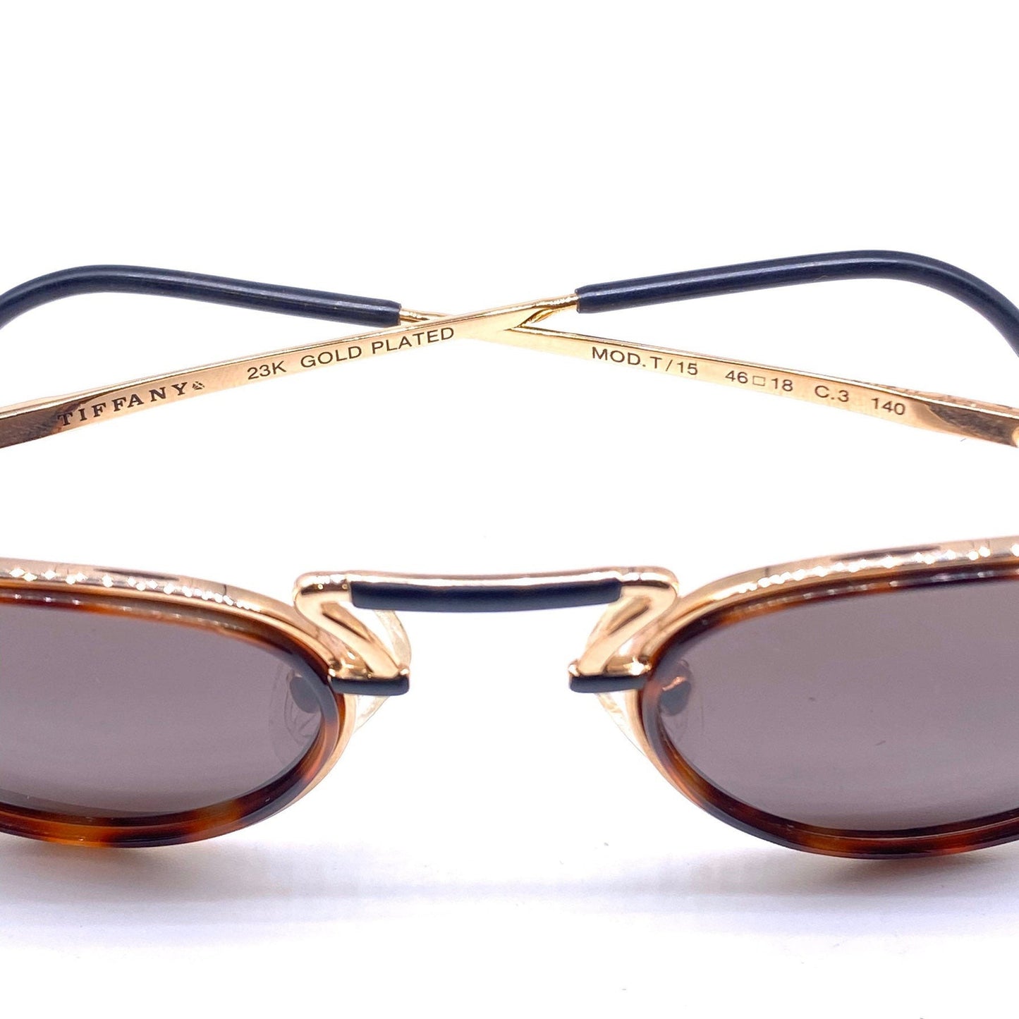 Tiffanys 23K gold plated round sunglasses with a superb design, rare and collectible piece in NOS condition.