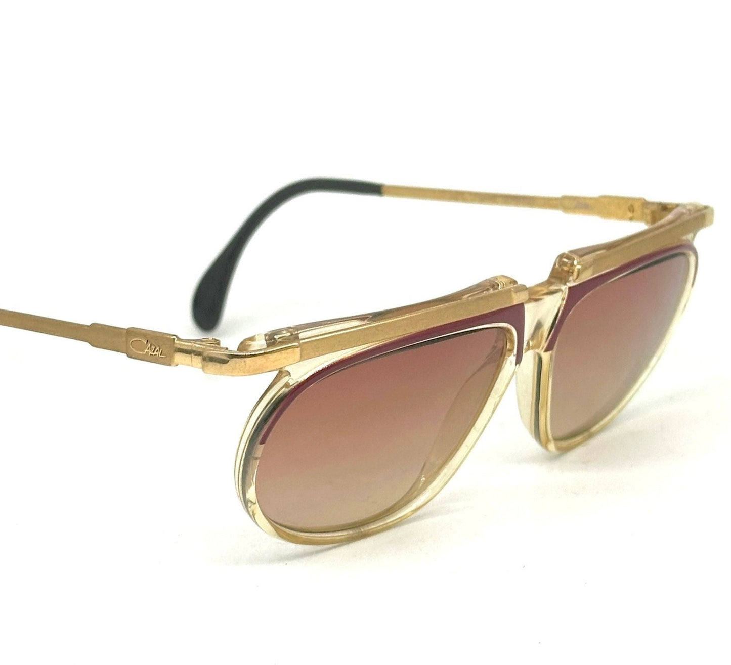 Cazal mod. 335 avant garde clear/red cello sunglasses w golden metal browline and temples, NOS 80s W Germany