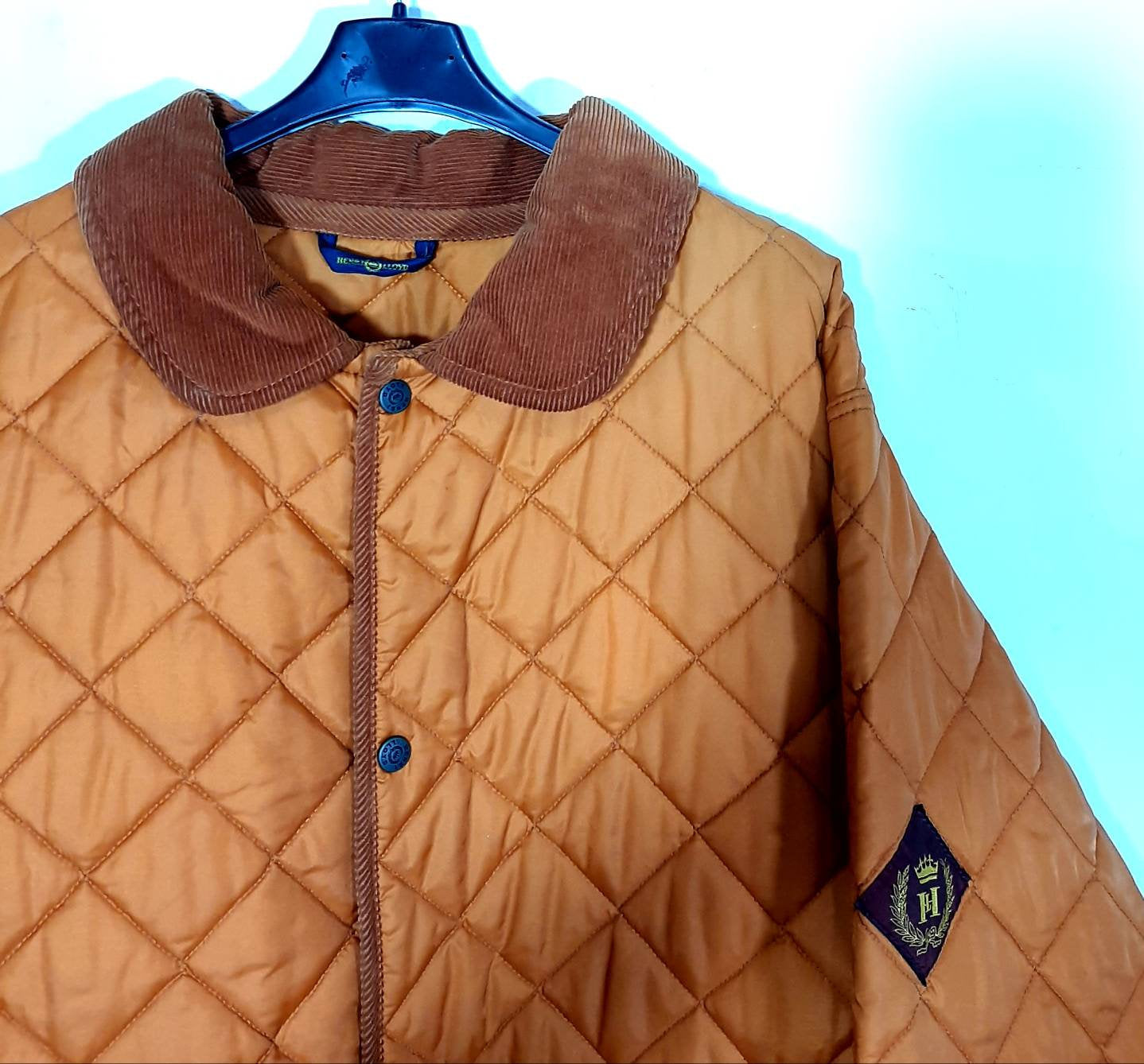 Quilted padded orange jacket in mint conditions by Henri Lloyd