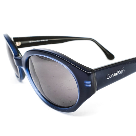 Calvin Klein  619S round oval deep  blue cellulose acetate sunglasses with classic rivets details NOS 90s Italy